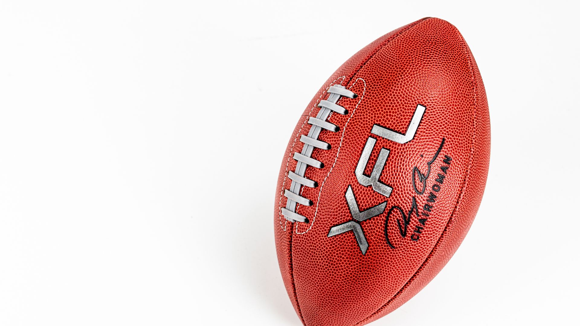 Football with the XFL logo. 