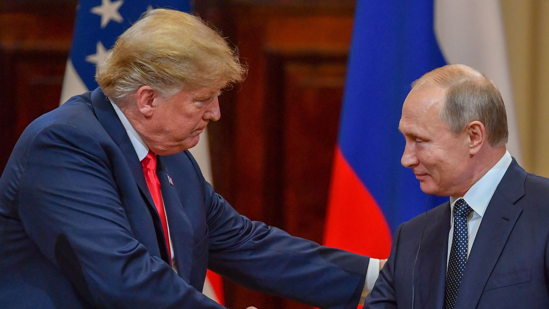 Trump shaking hands with Putin