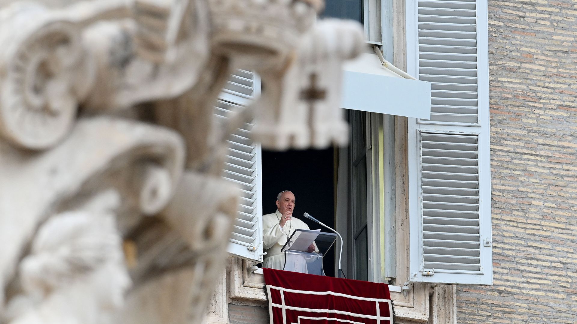 Photo of Pope Francis delivering the Angelus prayer from the window of the apostolic palace overlooking St. Peter's Square