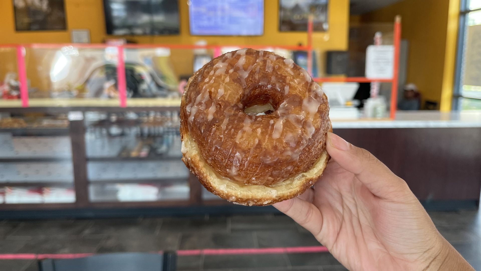 A photo of a glazed cronut from	ChuChu Donuts.