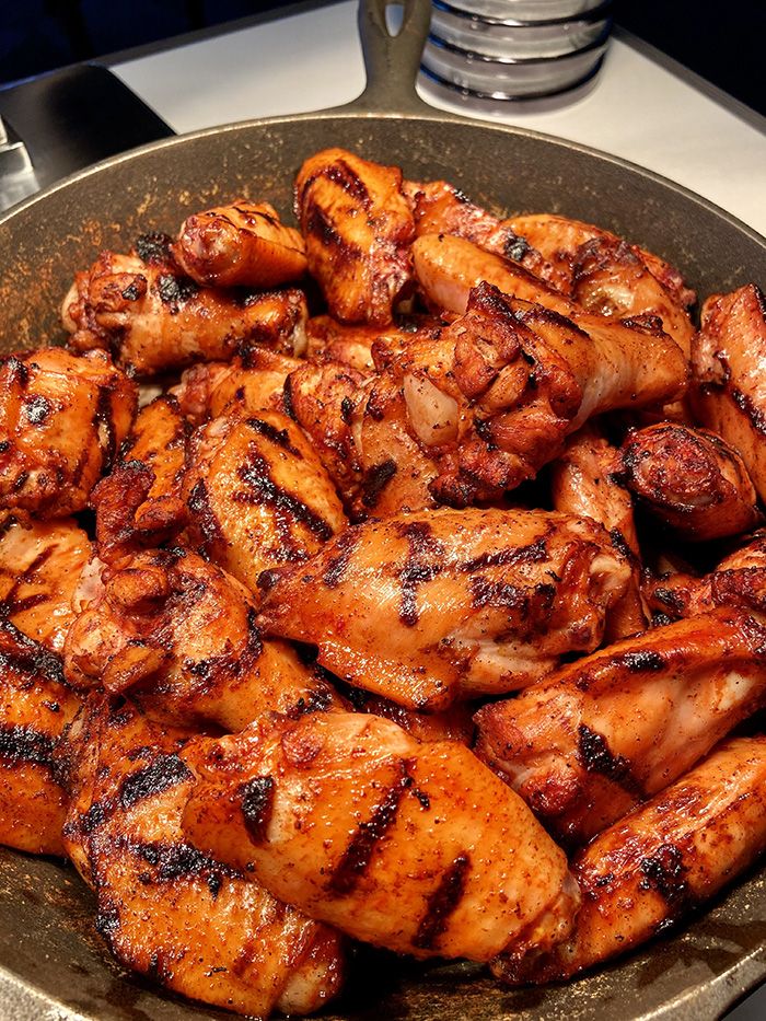 Wing toss: seasoned grilled and wings, celery and carrots, buffalo sauce. Photo: Ashley Mahoney/Axios 