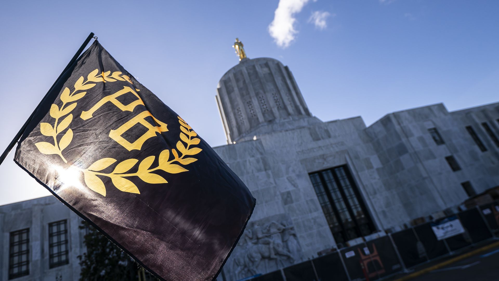 A Proud Boy flag flies in front of the Oregon state capitol during a protest in support of the January 6 attack on the U.S. Capitol on January 8, 2022.