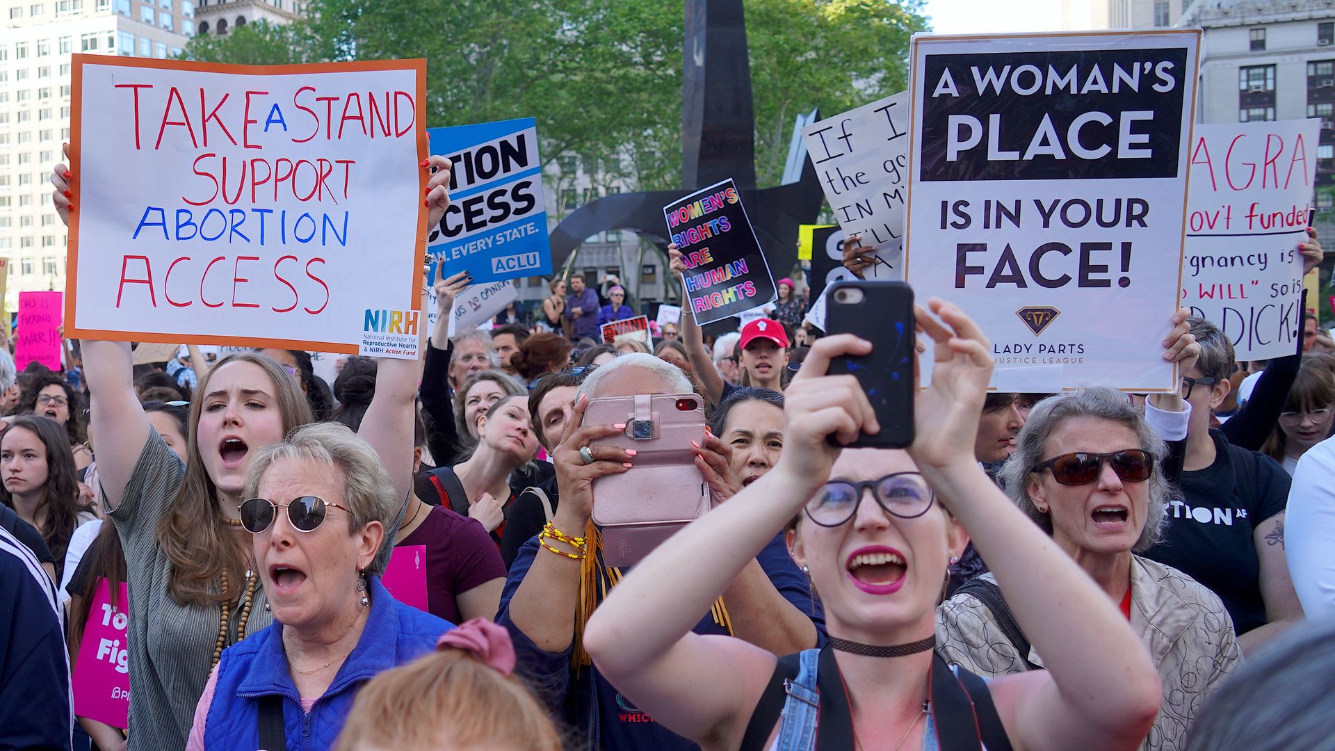 In this image, protestors hold pro-abortion signs.