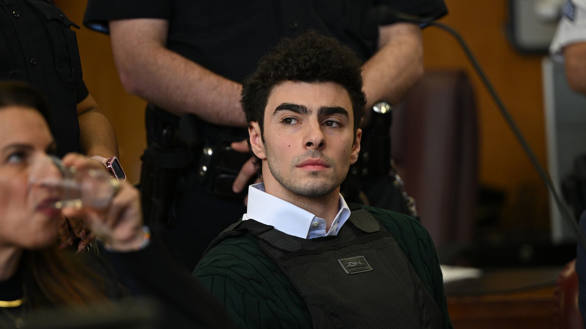 Luigi Mangione looks on in court.