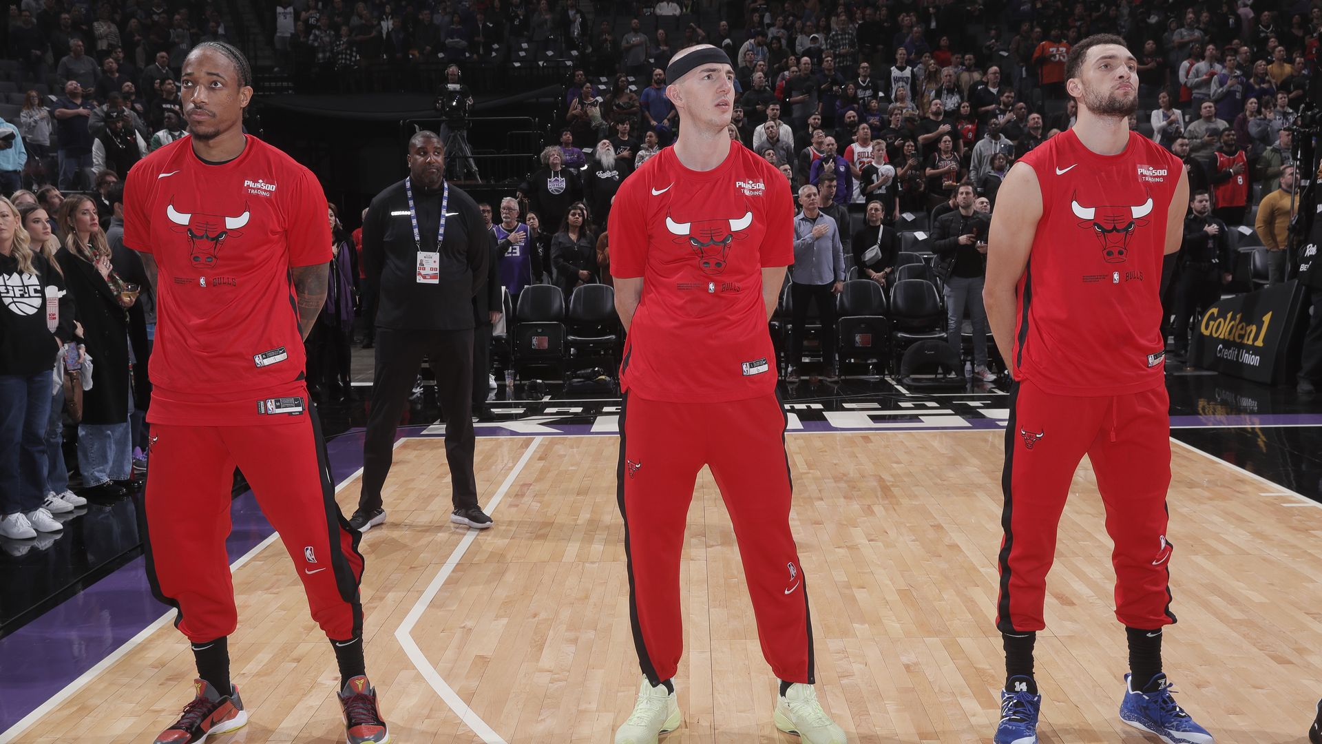 Photo of three basketball players before a game 