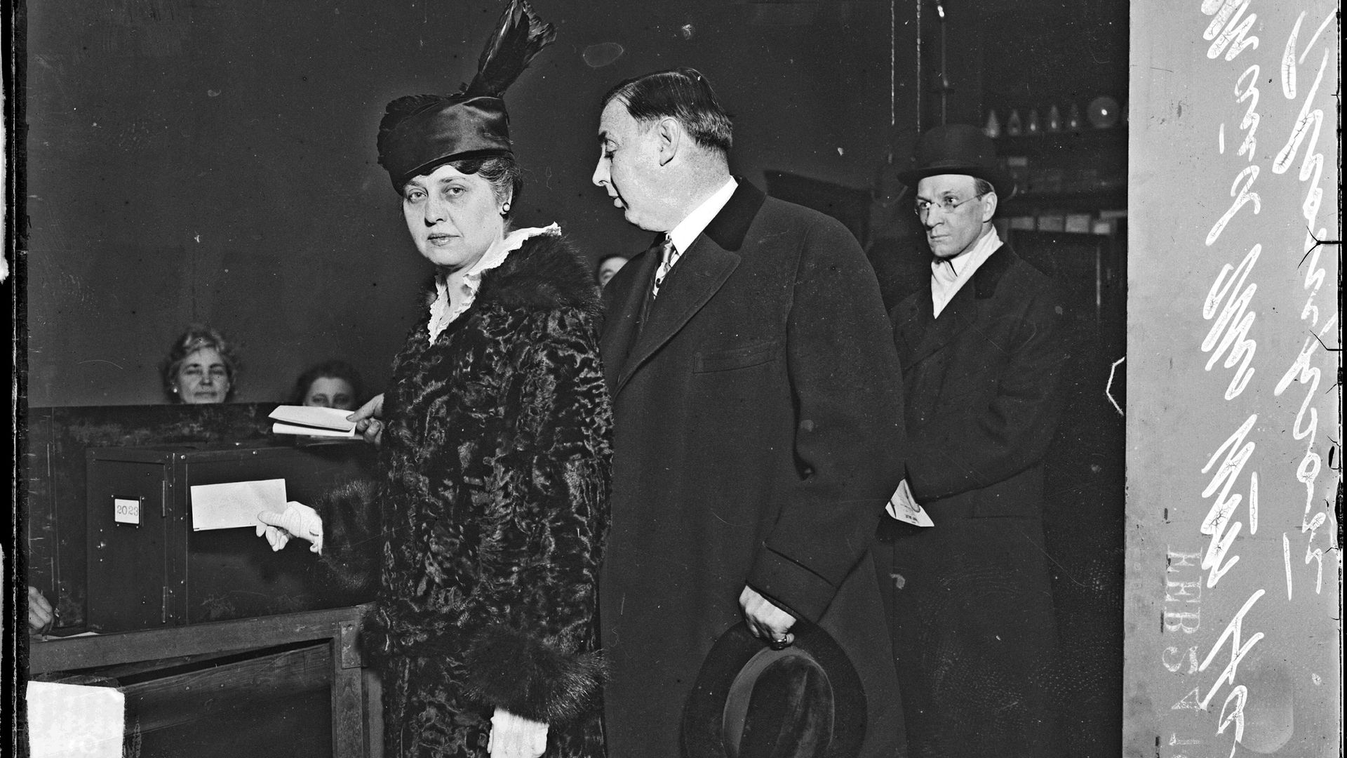 Photo of a woman voting. 