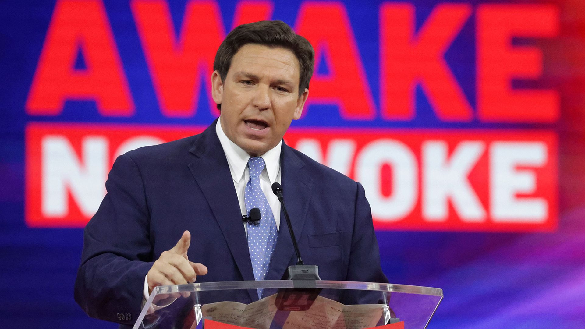 Photo of Ron DeSantis speaking from a podium on a stage