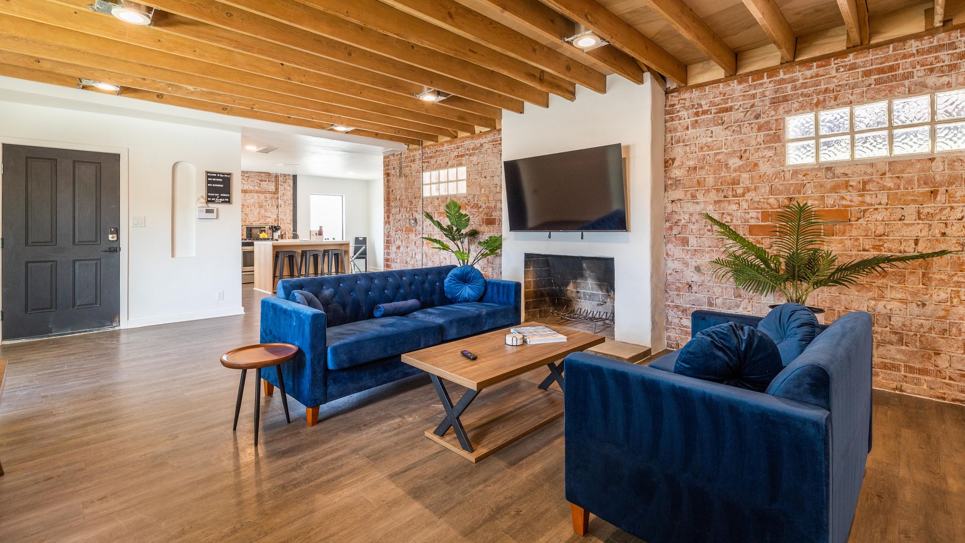 An open-concept house with exposed brick.