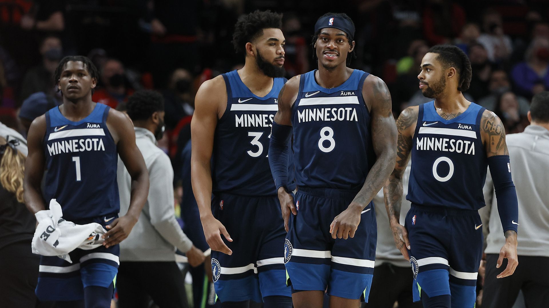Wolves players walk on the court