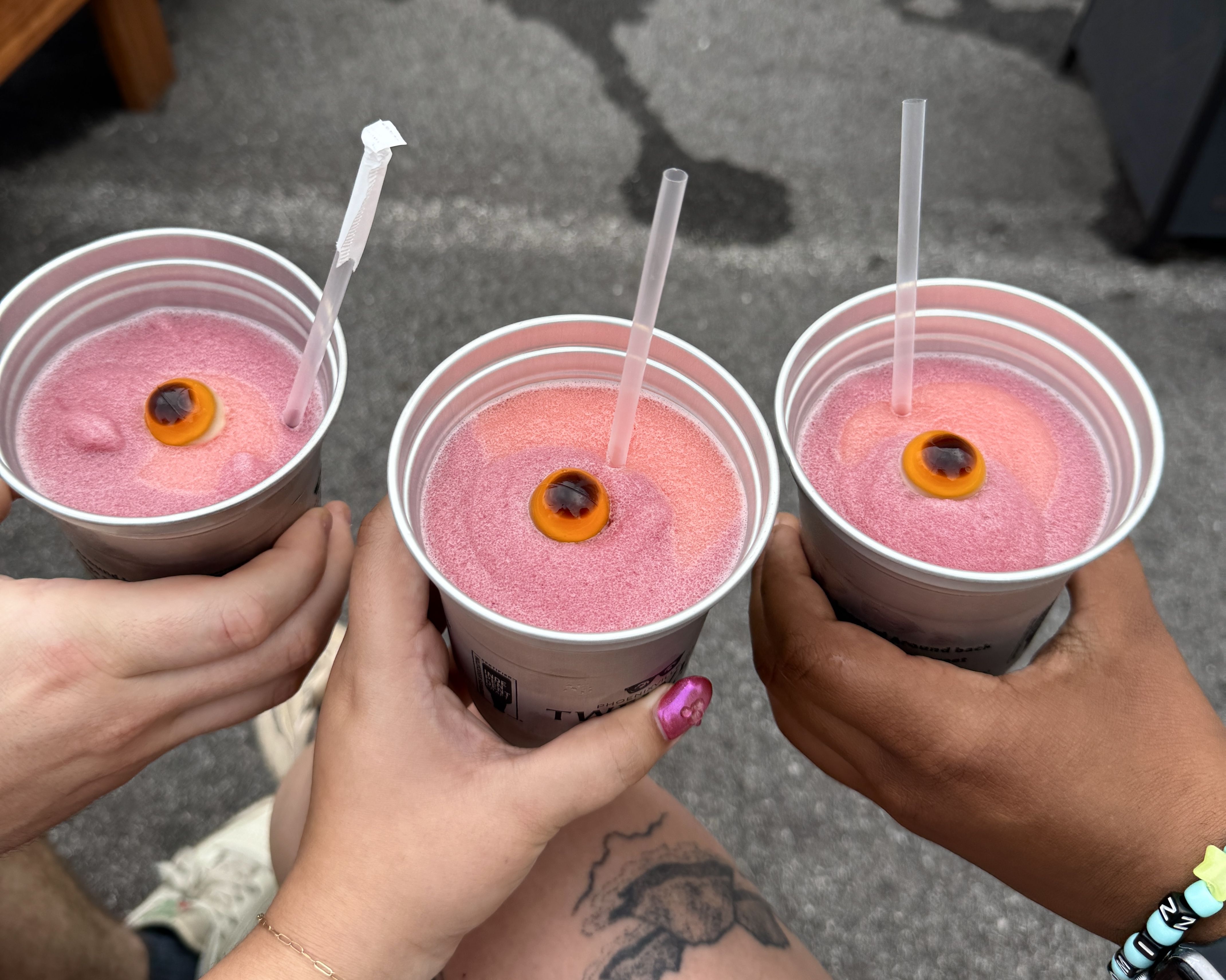 Three slushies with eyeballs in them