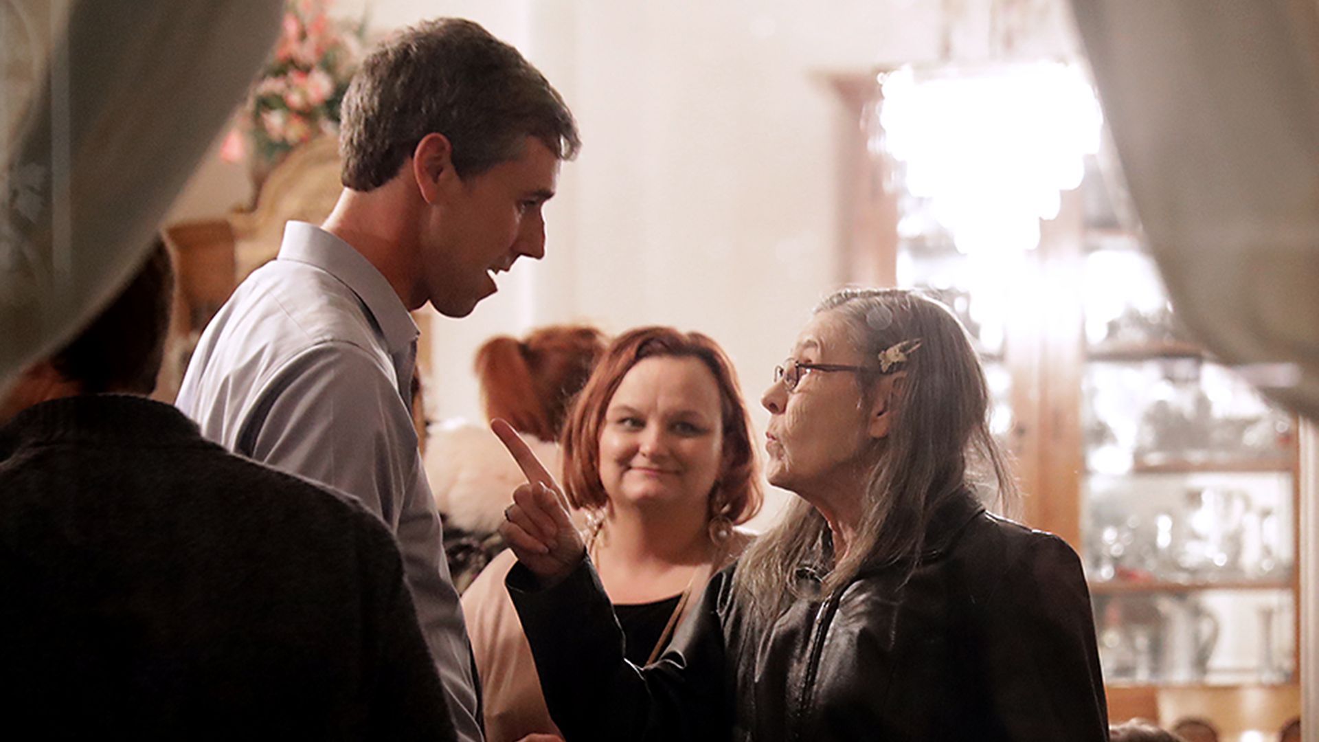 In this image, Beto O'Rourke is confronted by an Iowa woman as she asks a question and points at him.