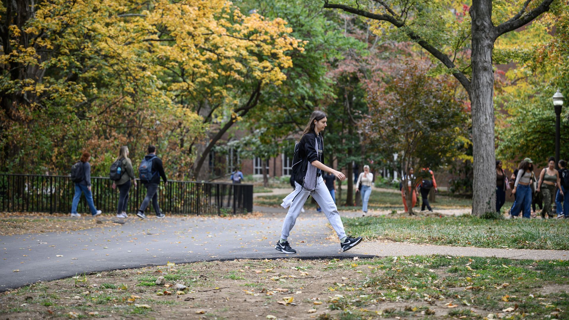 Students make their way around campus at Vanderbilt University. The leaves are changing.