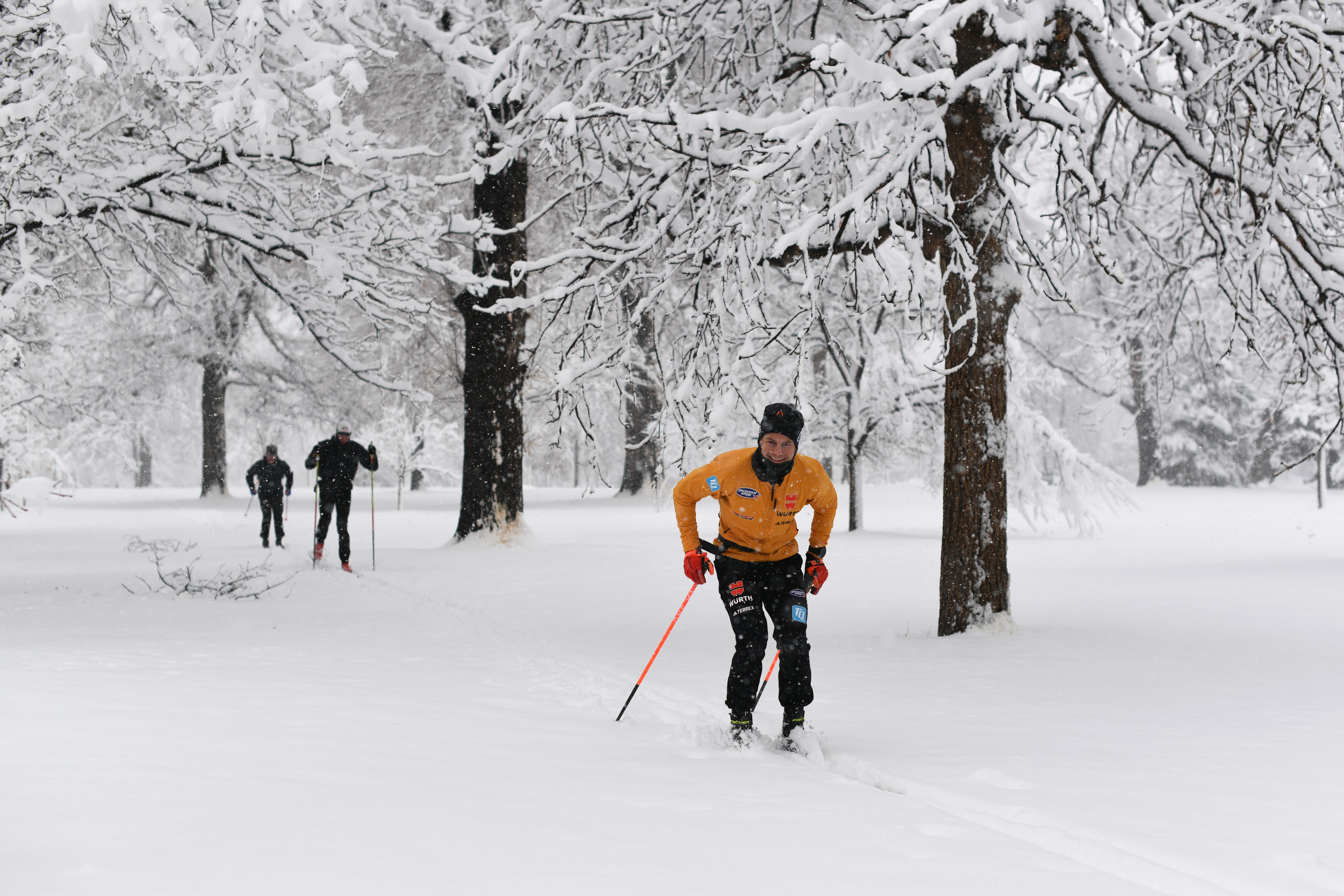 Florian Knopf, front, and the University of Denver cross country ski team make loops at snow covered Washington Park. Photo: Hyoung Chang/The Denver Post