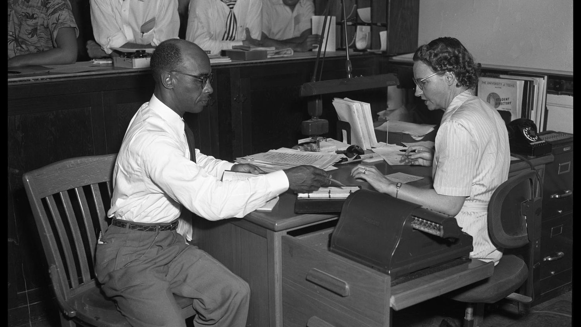 Heman Sweatt registering for class.