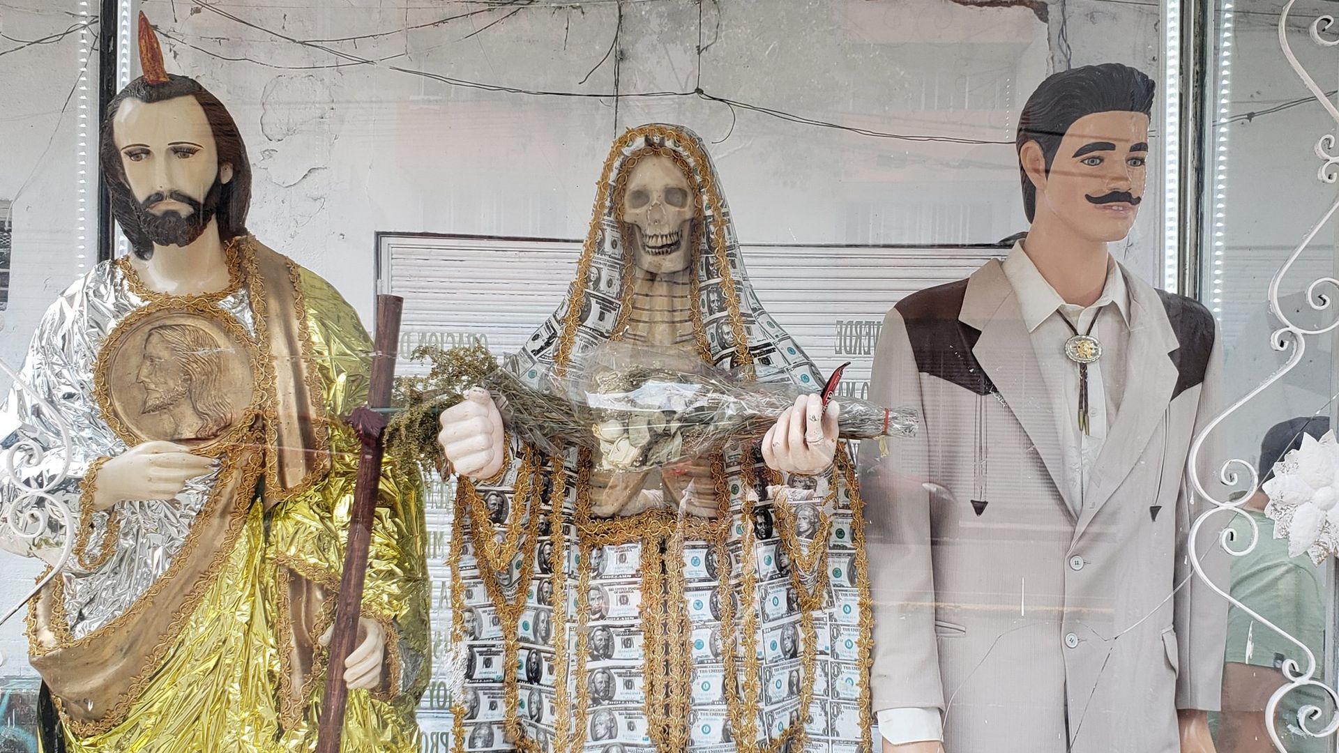 Statues of Santa Muerte, Jesus Malverde and Saint Jude in Colonia Doctores of Mexico City.