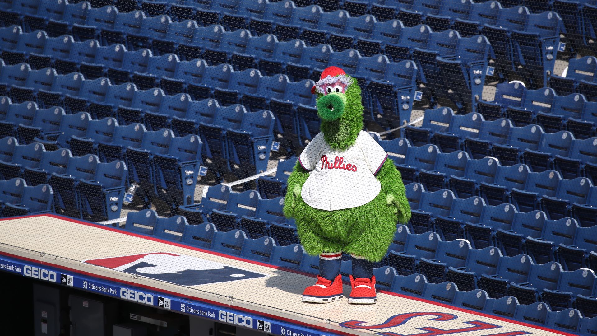 The Phillie Phanatic stands on the dugout during a game between the Miami Marlins and Philadelphia Phillies on July 26.
