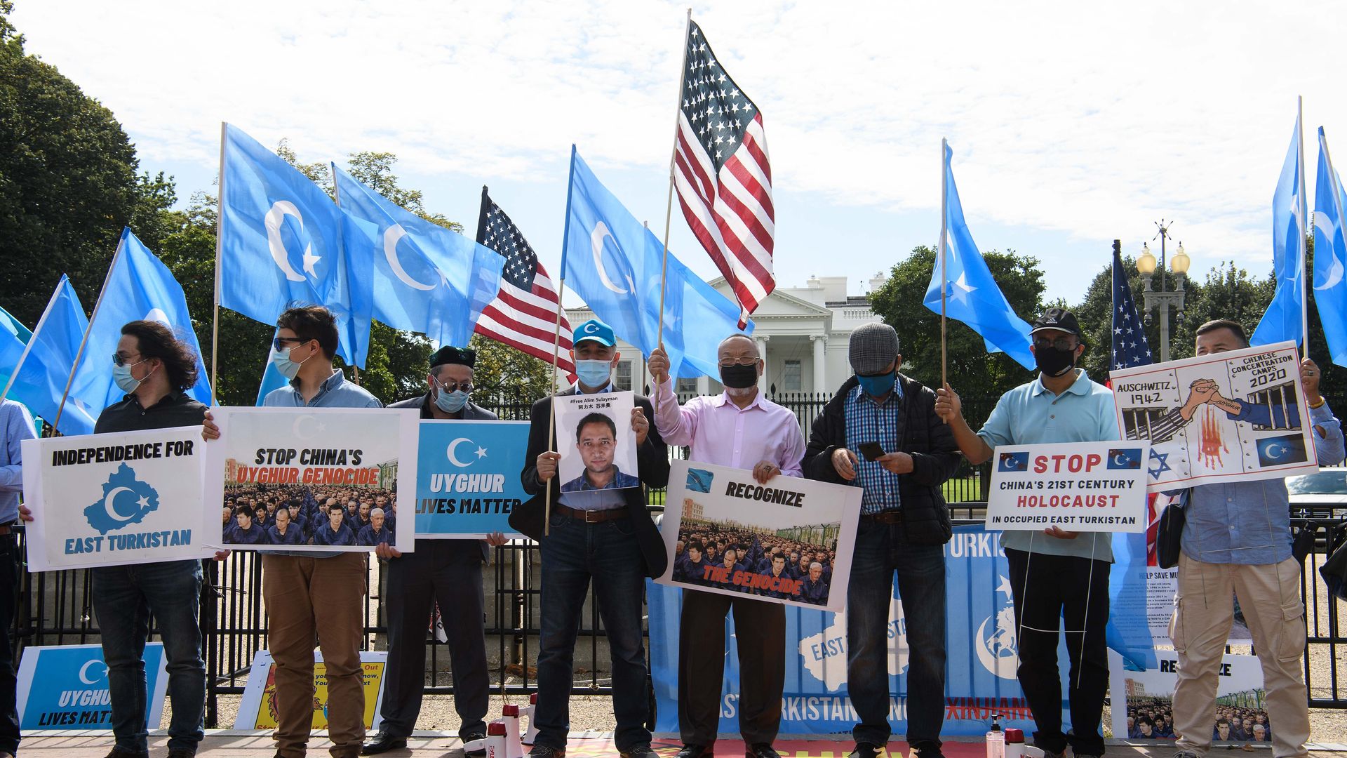 Pro-Uyghur protesters are seen highlighting their cause outside the White House.