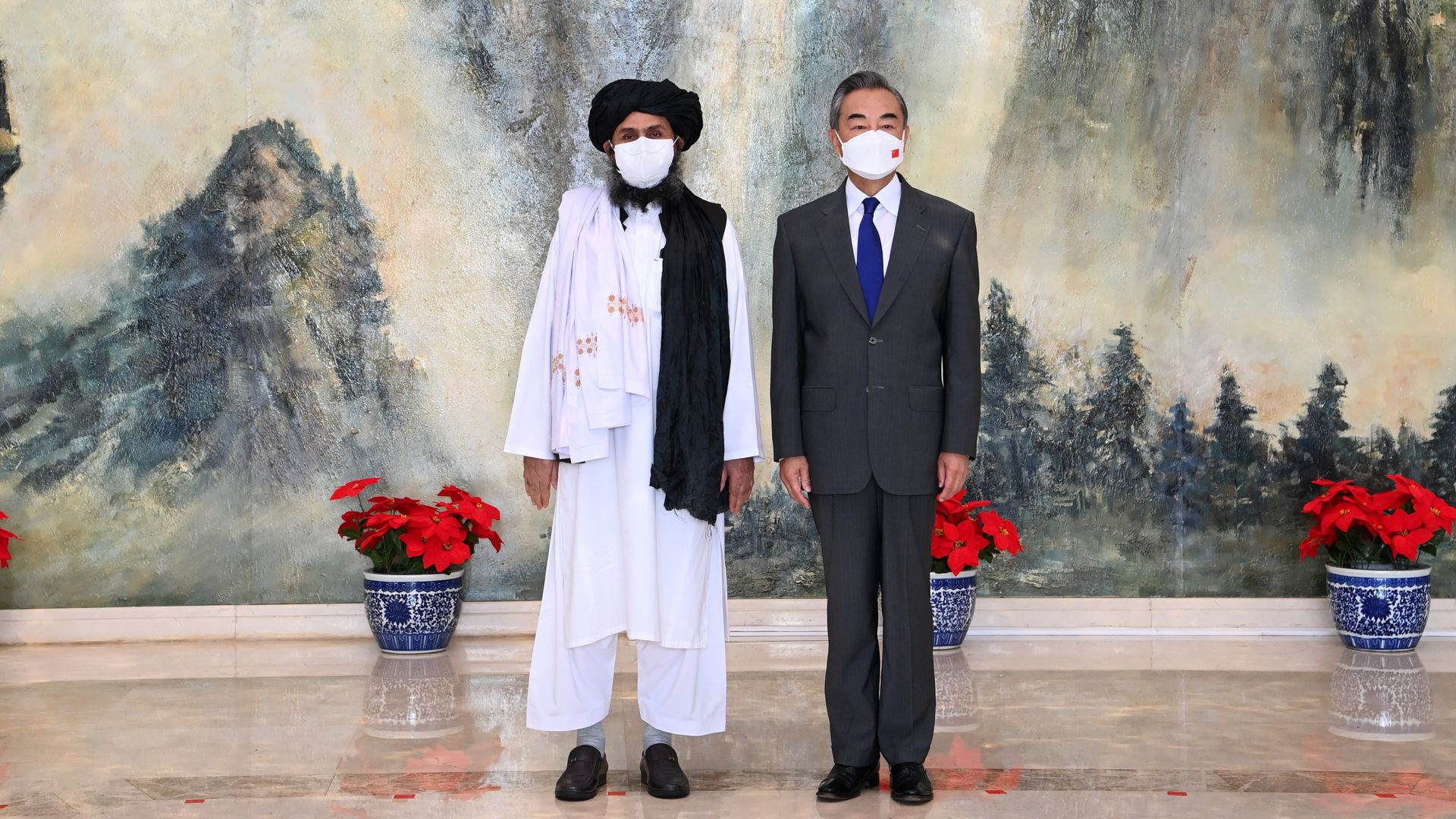 Chinese Foreign Minister Wang Yi meets with Mullah Abdul Ghani Baradar, political chief of Afghanistan's Taliban, in Tianjin in July 2021.