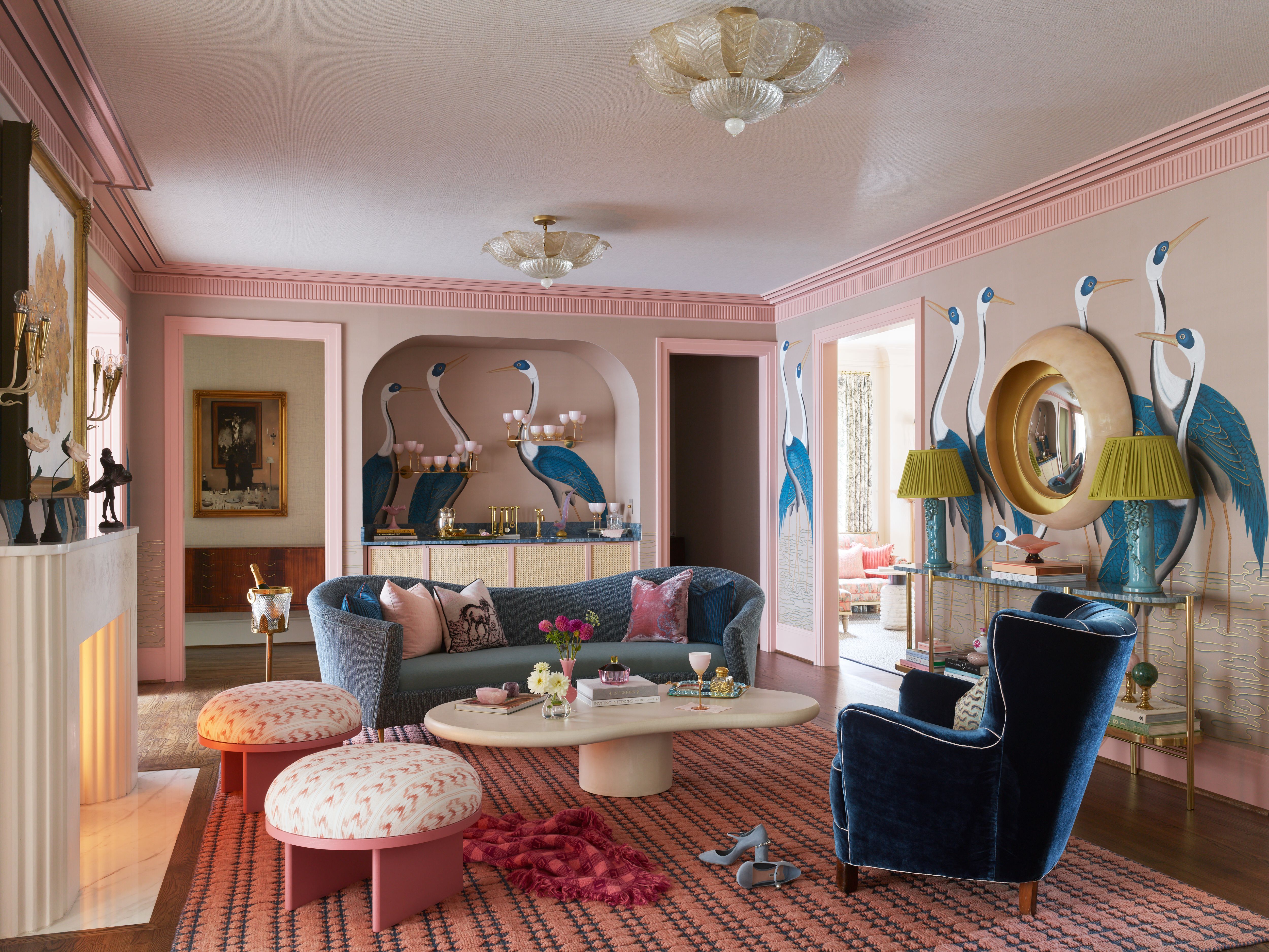 luxurious pink living room with blue crane wallpaper