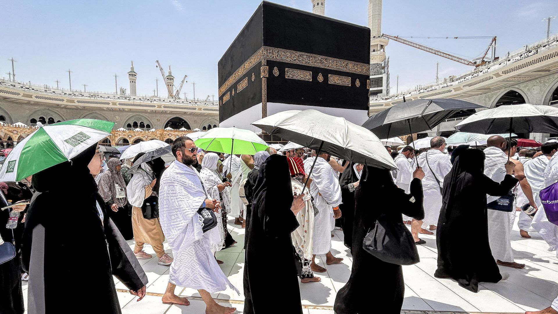 Muslim worshippers walk around the Kaaba, Islam's holiest shrine, at the Grand Mosque in Saudi Arabia's holy city of Mecca on June 13, 2024, ahead of the annual Hajj pilgrimage