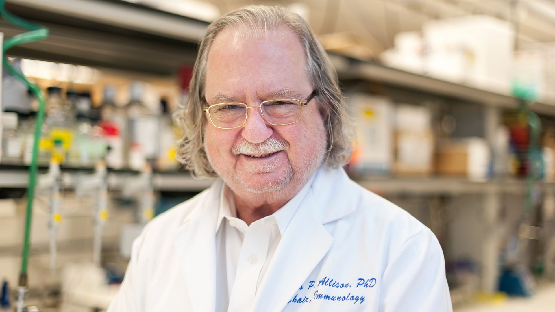 Photo of Jim Allison, who won the 2018 Nobel Prize, in his lab coat.