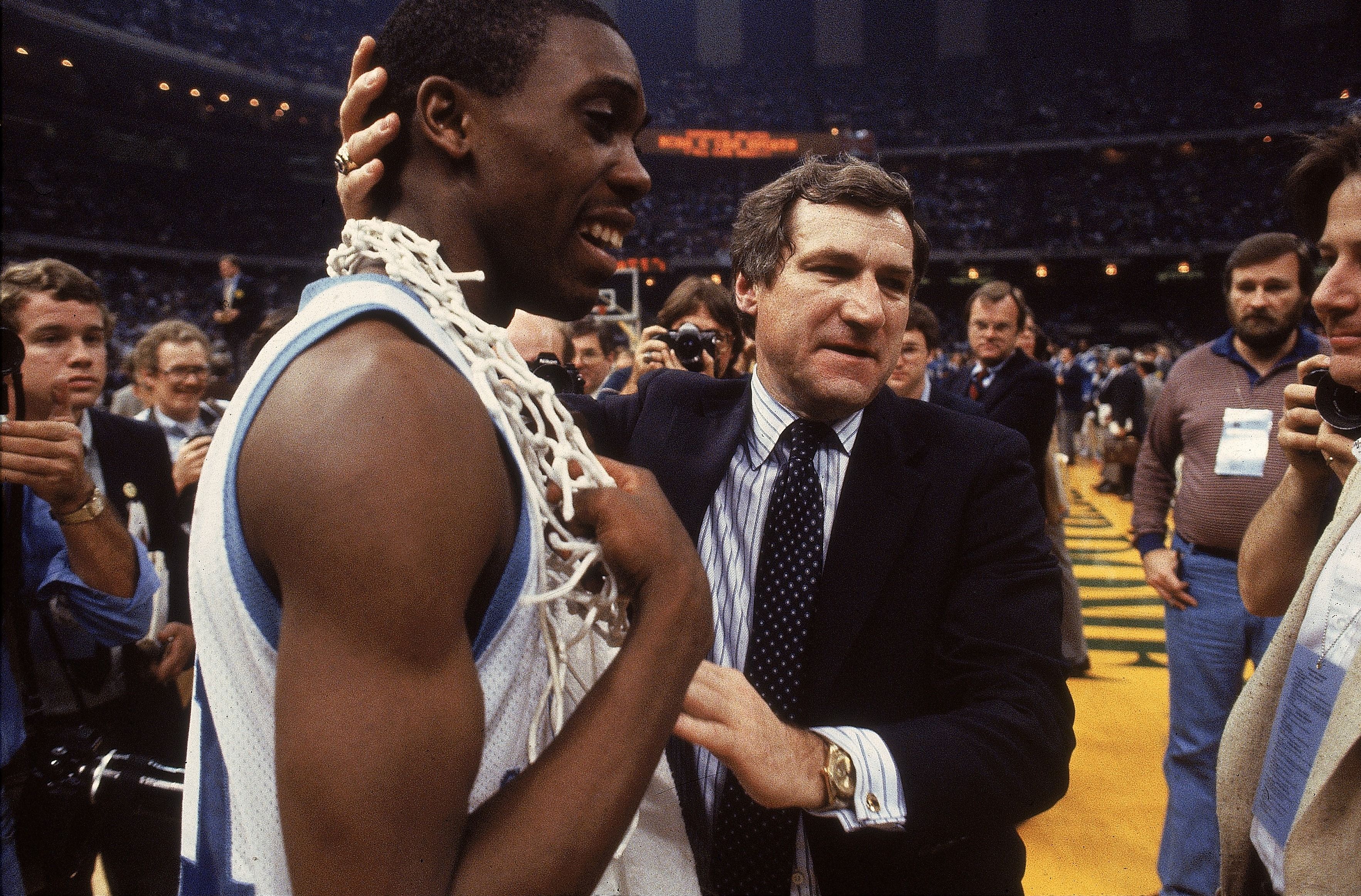UNITED STATES - MARCH 29: College Basketball: NCAA Final Four, Closeup of North Carolina coach Dean Smith victorious with Jimmy Black (21) after winning championship game vs Georgetown, New Orleans, LA 3/29/1982 (Photo by Manny Millan/Sports Illustrated via Getty Images) (SetNumber: X26693 TK2 R5 F18)