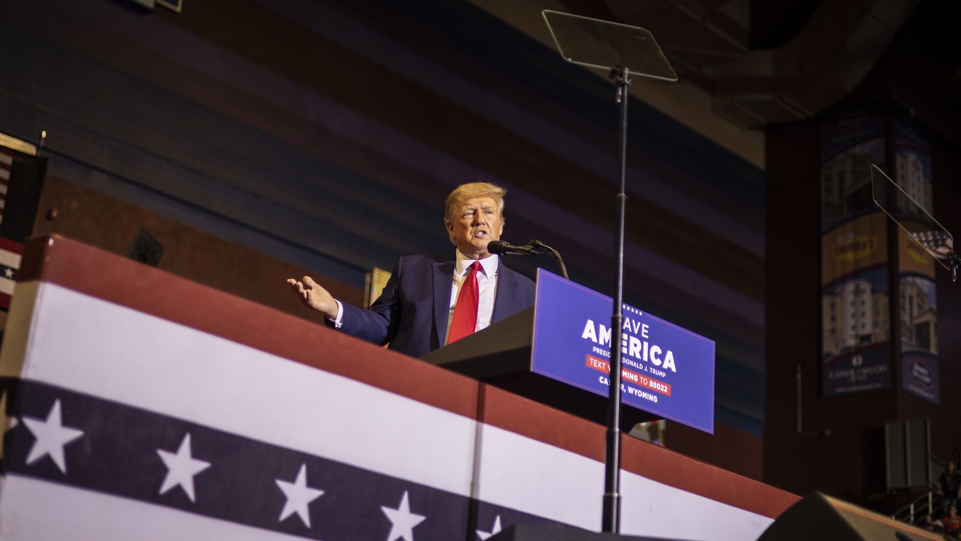 Photo of Donald Trump speaking from a podium while gesturing with his right hand