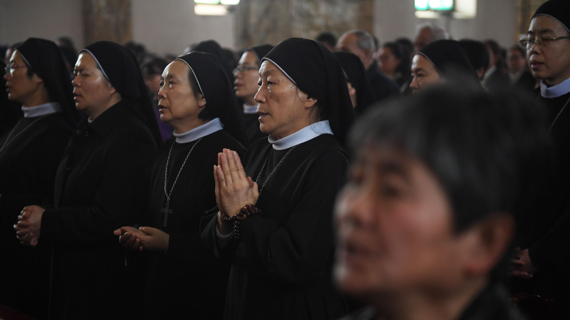 Catholic nuns at mass. 