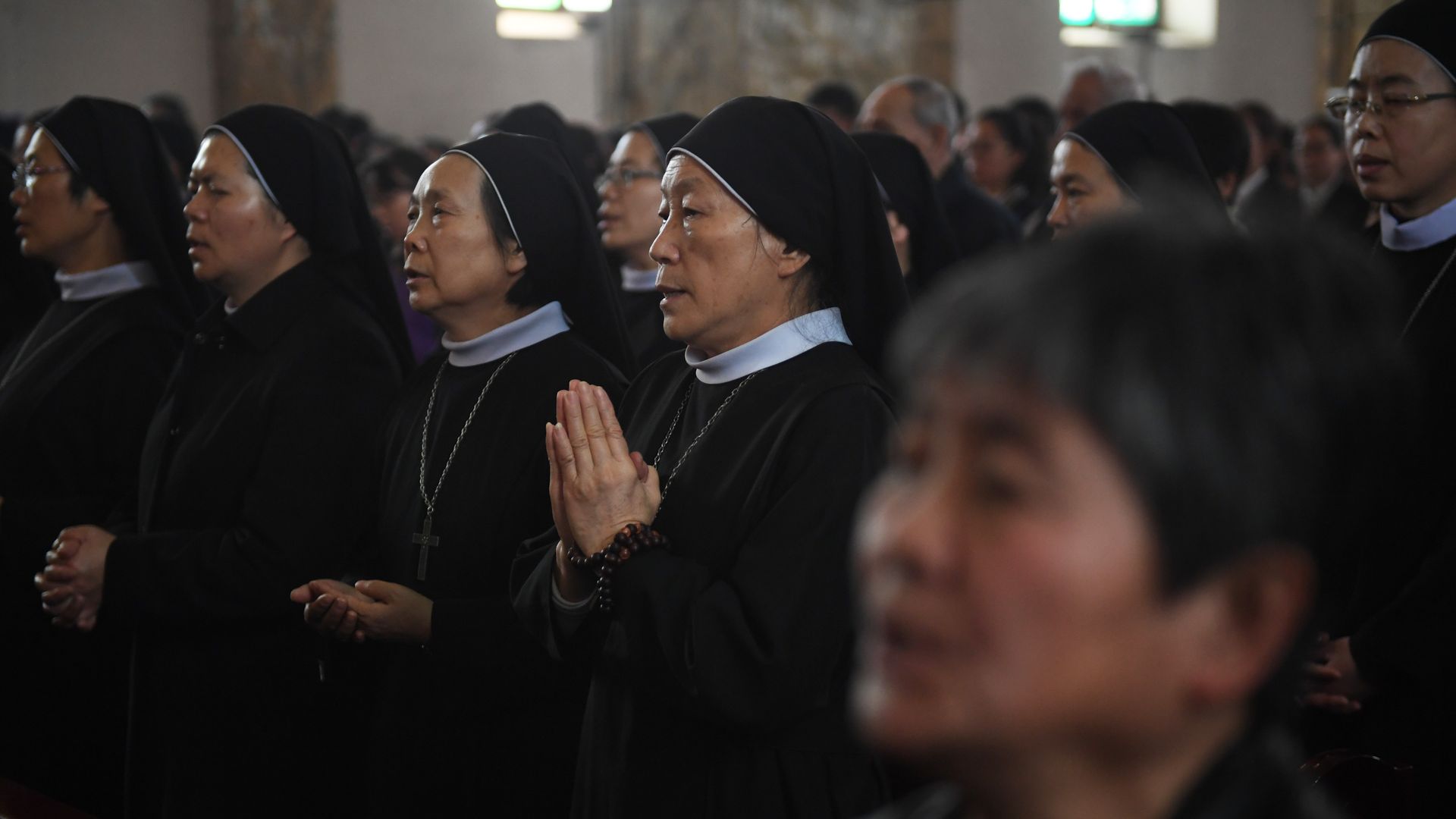 Catholic nuns at mass.