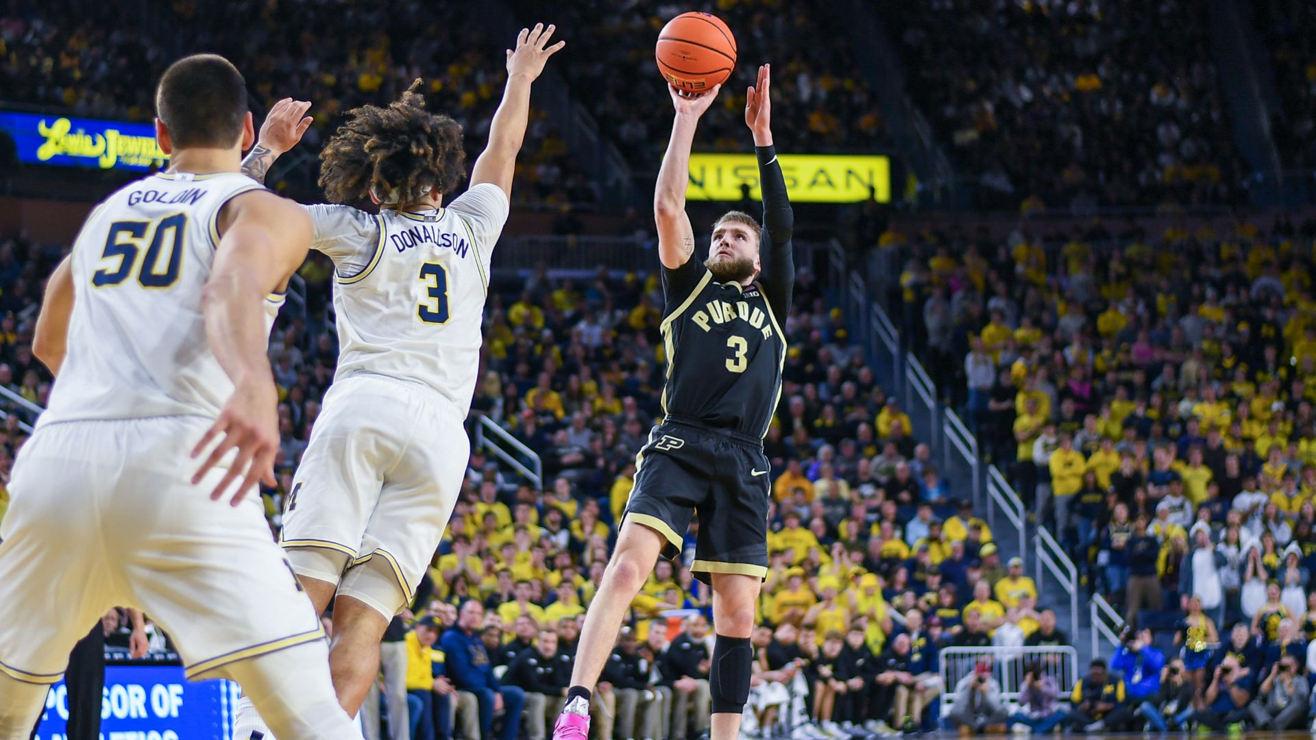 Braden Smith #3 of the Purdue Boilermakers shoots the ball over Tre Donaldson #3 of the Michigan Wolverines during the first half of a college basketball game at Crisler Arena on February 11, 2025 in Ann Arbor, Michigan. 