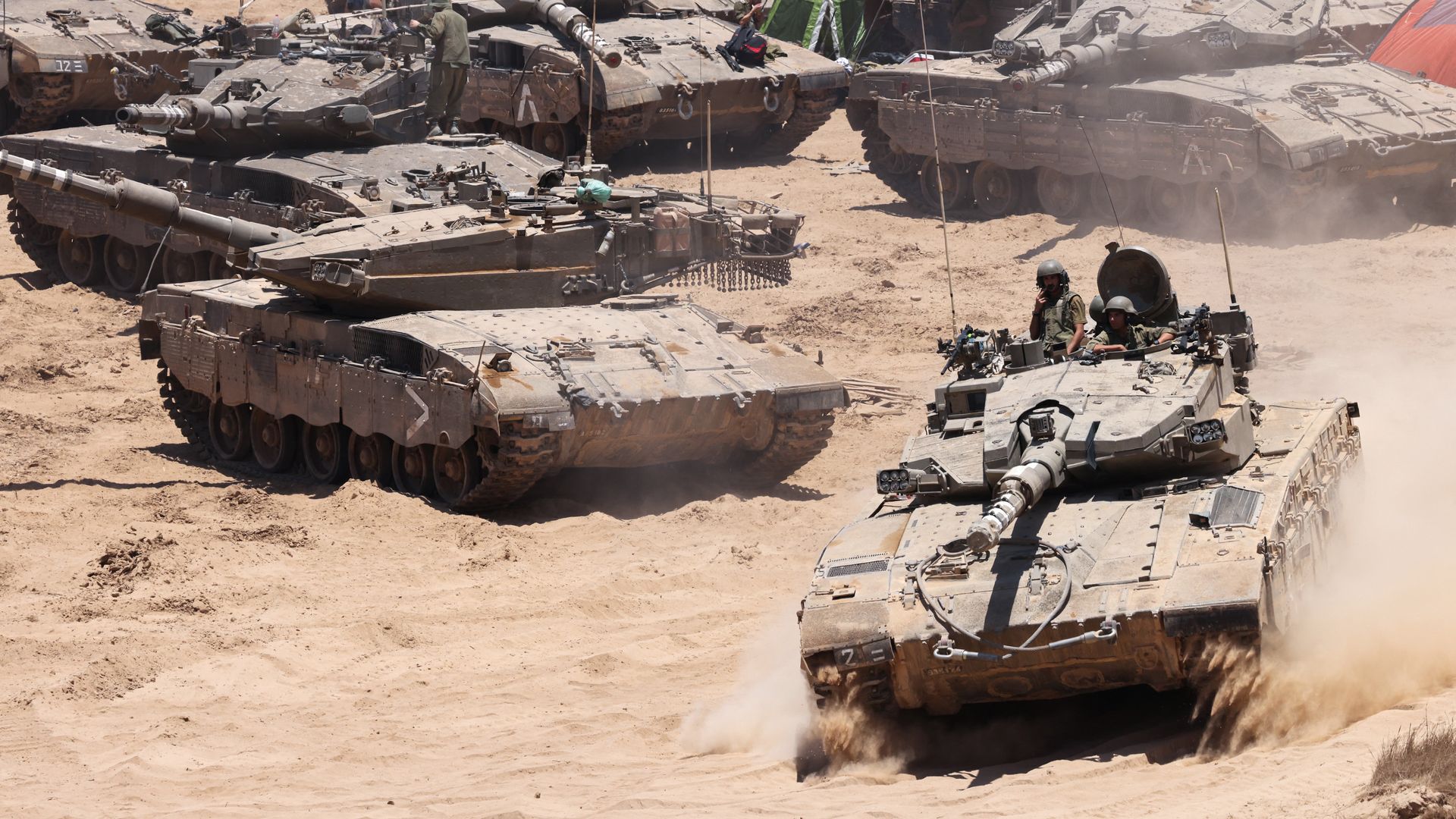 Israeli army tanks deploy in an area of Israel's southern border with the Gaza Strip on June 5, 2024,