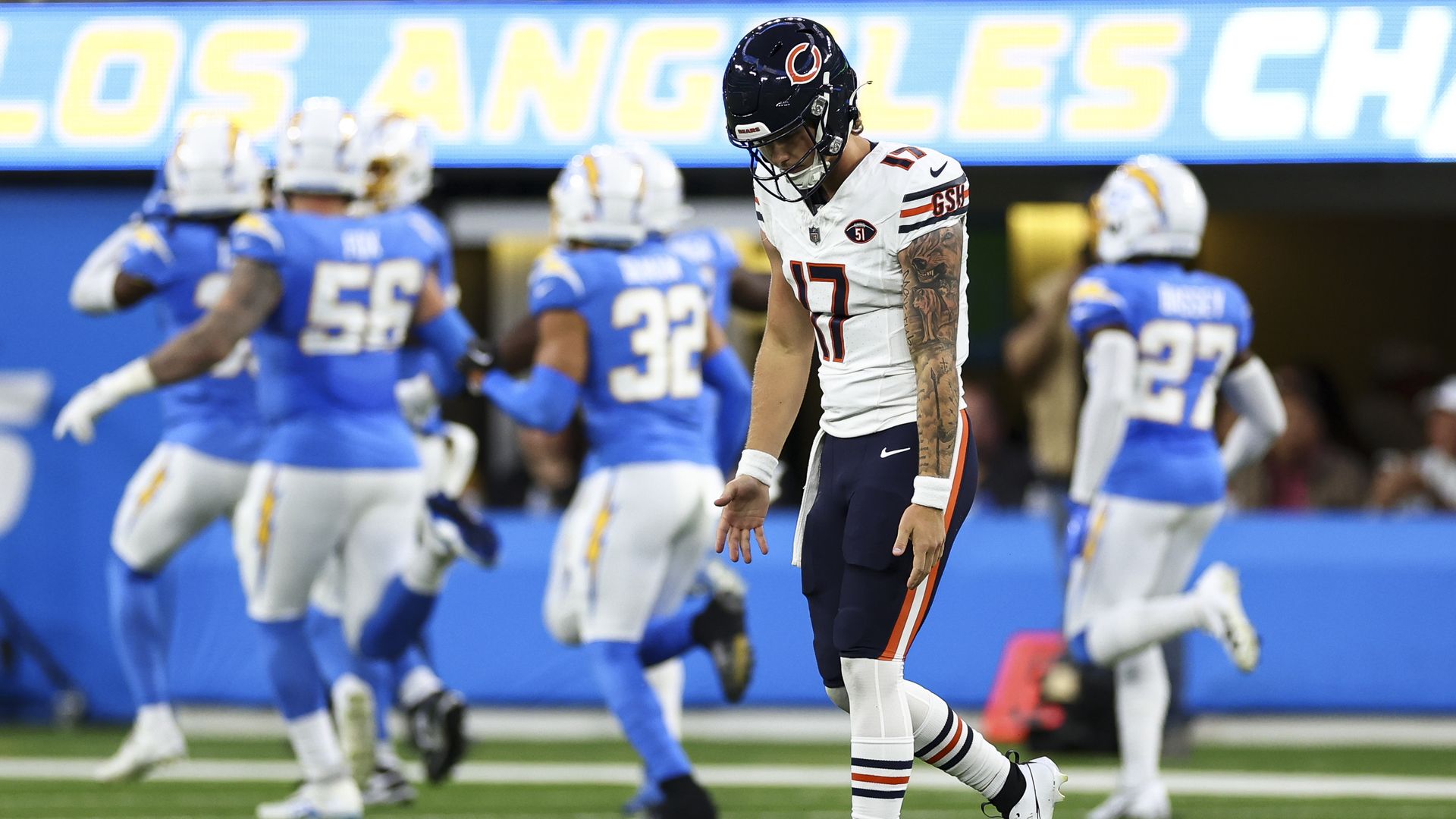 Photo of football player with his head down