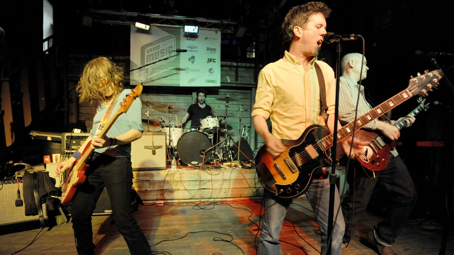 (L - R) Laura Ballance, Jon Wurster, Mac McCaughan, and Jim Wilbur of Superchunk perform at Cedar Street Courtyard as part of SXSW 2010 in Austin, Texas. (Photo by Tim Mosenfelder/Corbis via Getty Images)