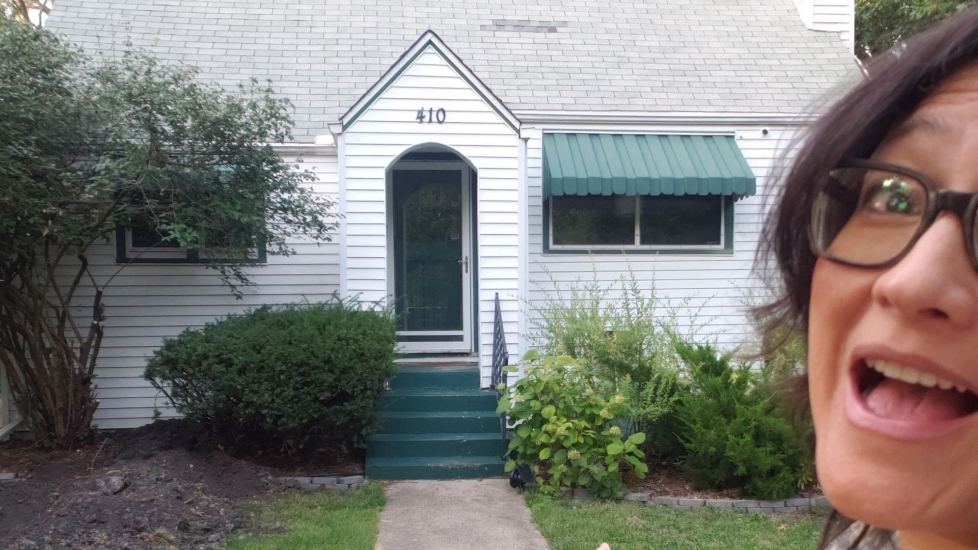 woman in front of house