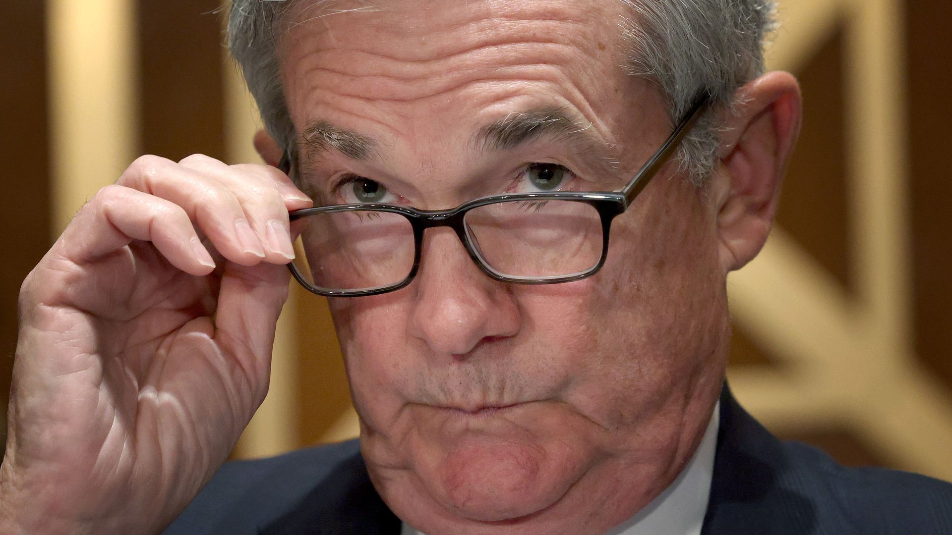 Federal Reserve Board Chair Jerome Powell adjusts his eyeglasses