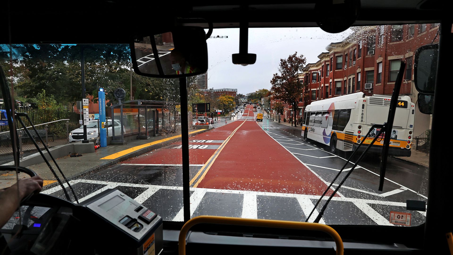 An MBTA worker drives the bus on a center-running bus lane on Columbus Avenue in Boston.