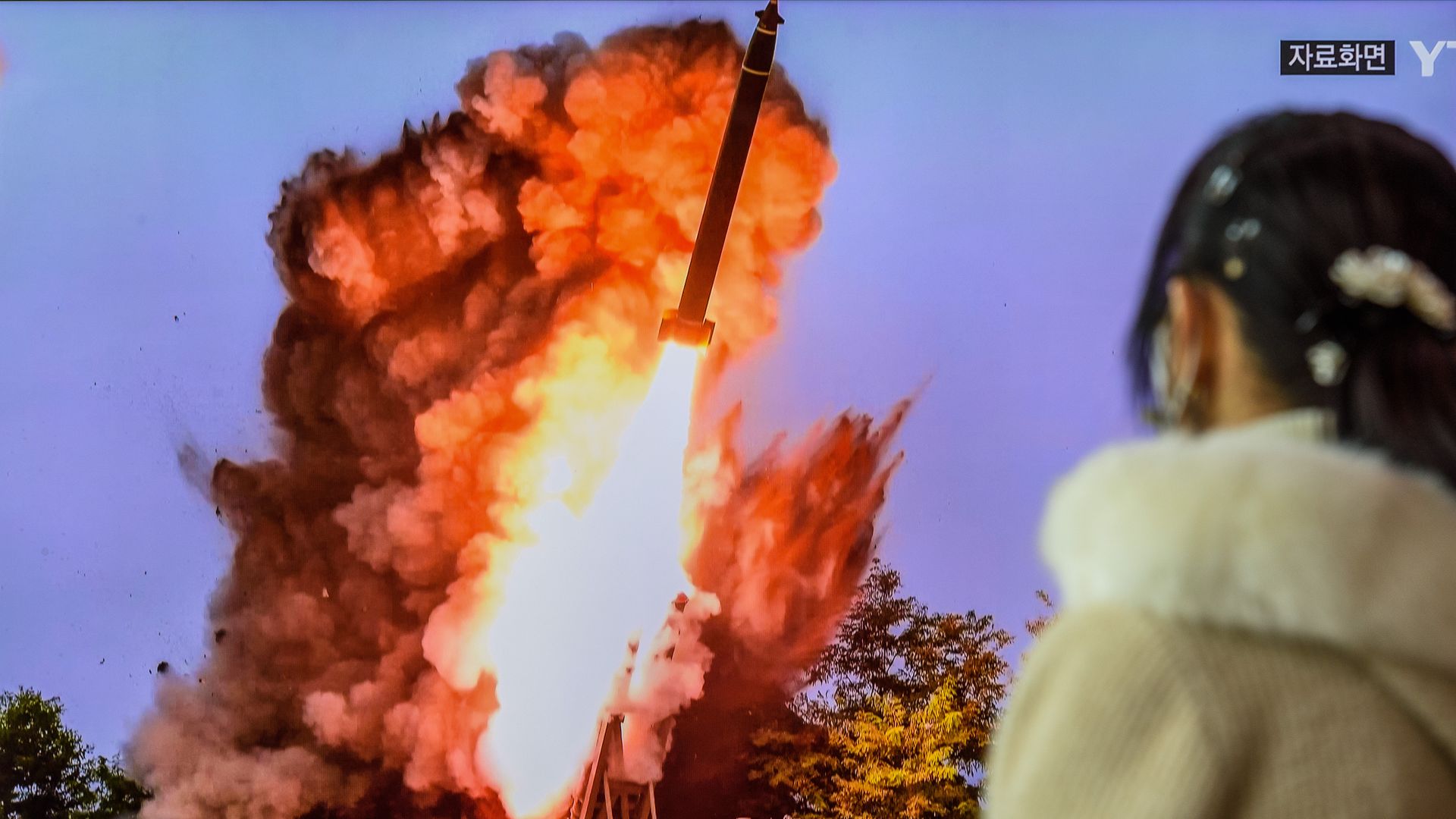 A woman watches a tv screen showing a file image of North Korea's missile launch during a news program at the Seoul Railway Station in Seoul earlier this month.