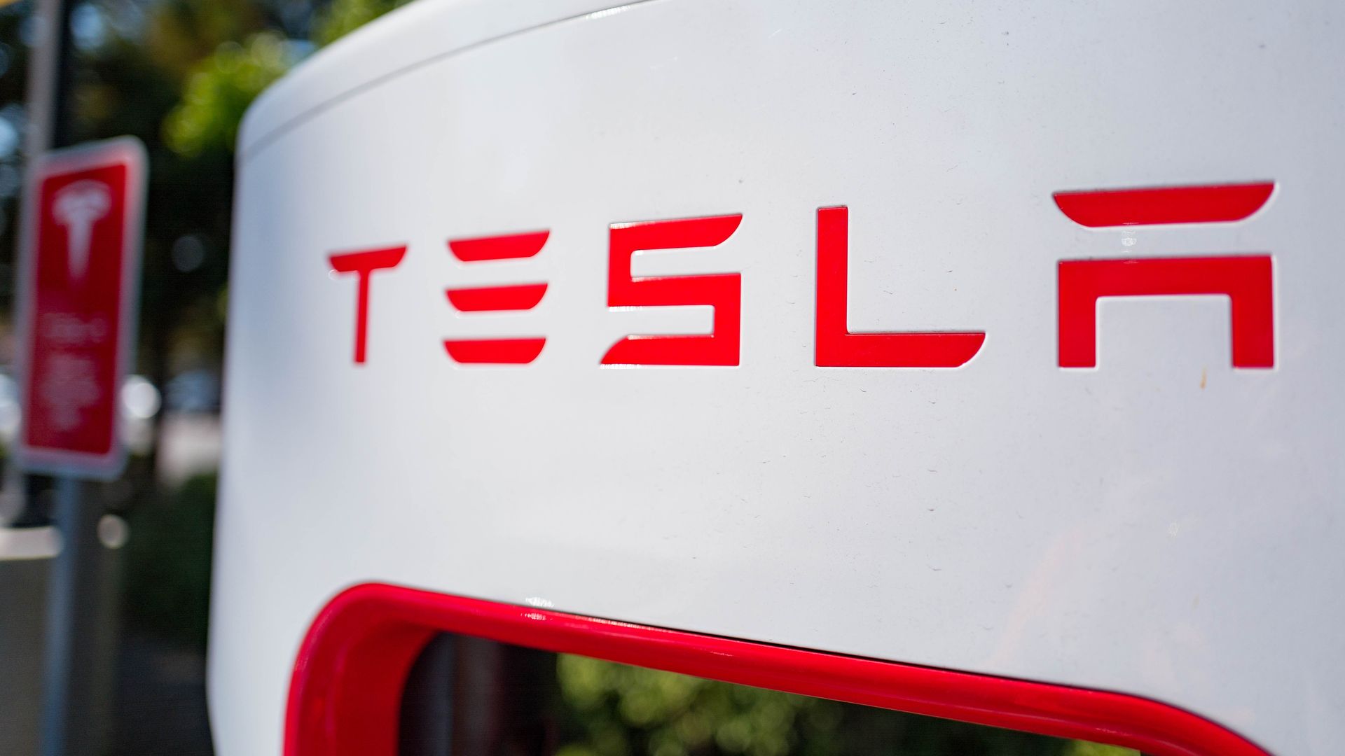 Close up of Tesla logo on a charger at a Supercharger rapid battery charging station for the electric vehicle company Tesla Motors, in the Silicon Valley town of Mountain View, California