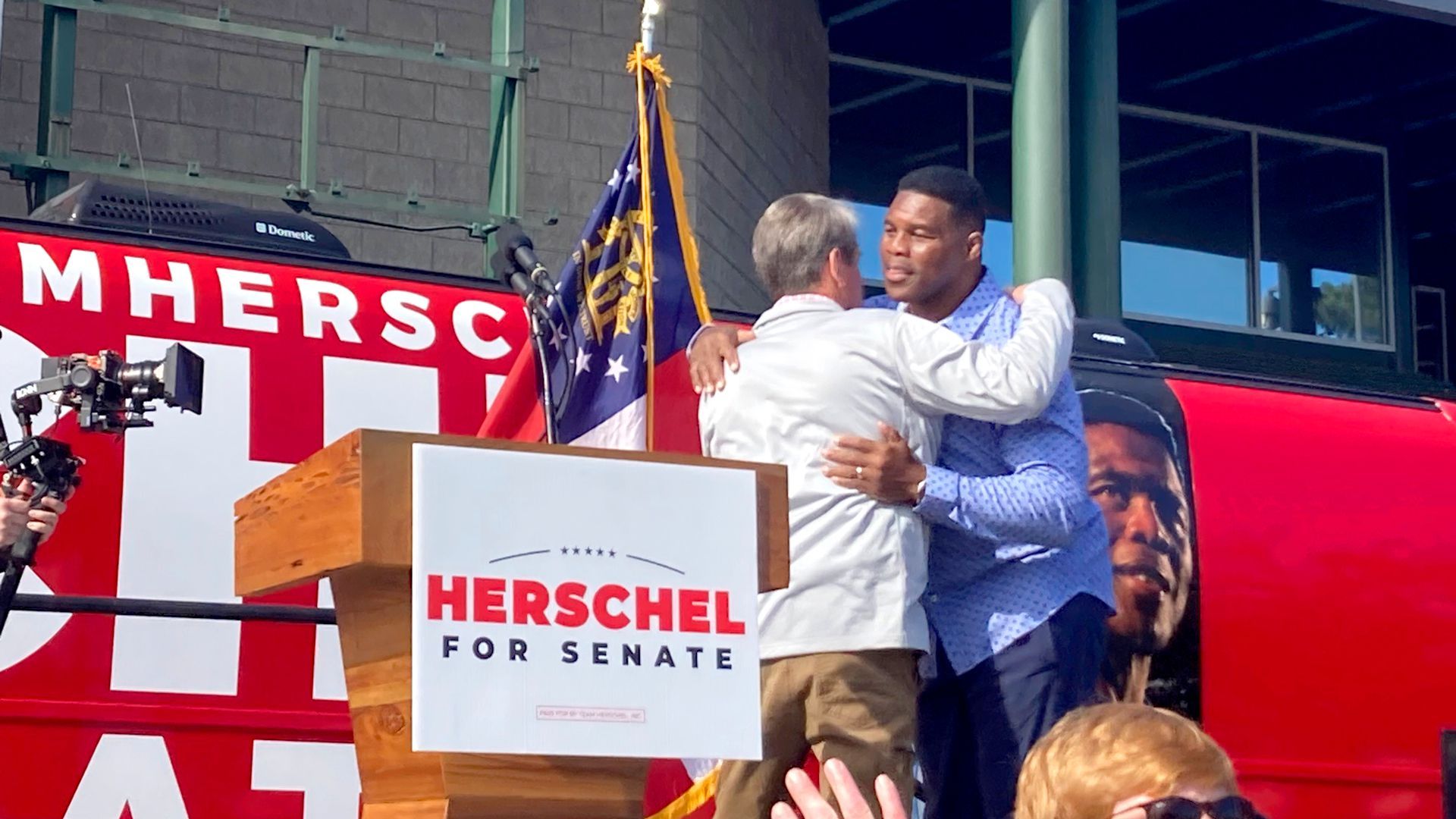 Brian Kemp hugging Herschel Walker