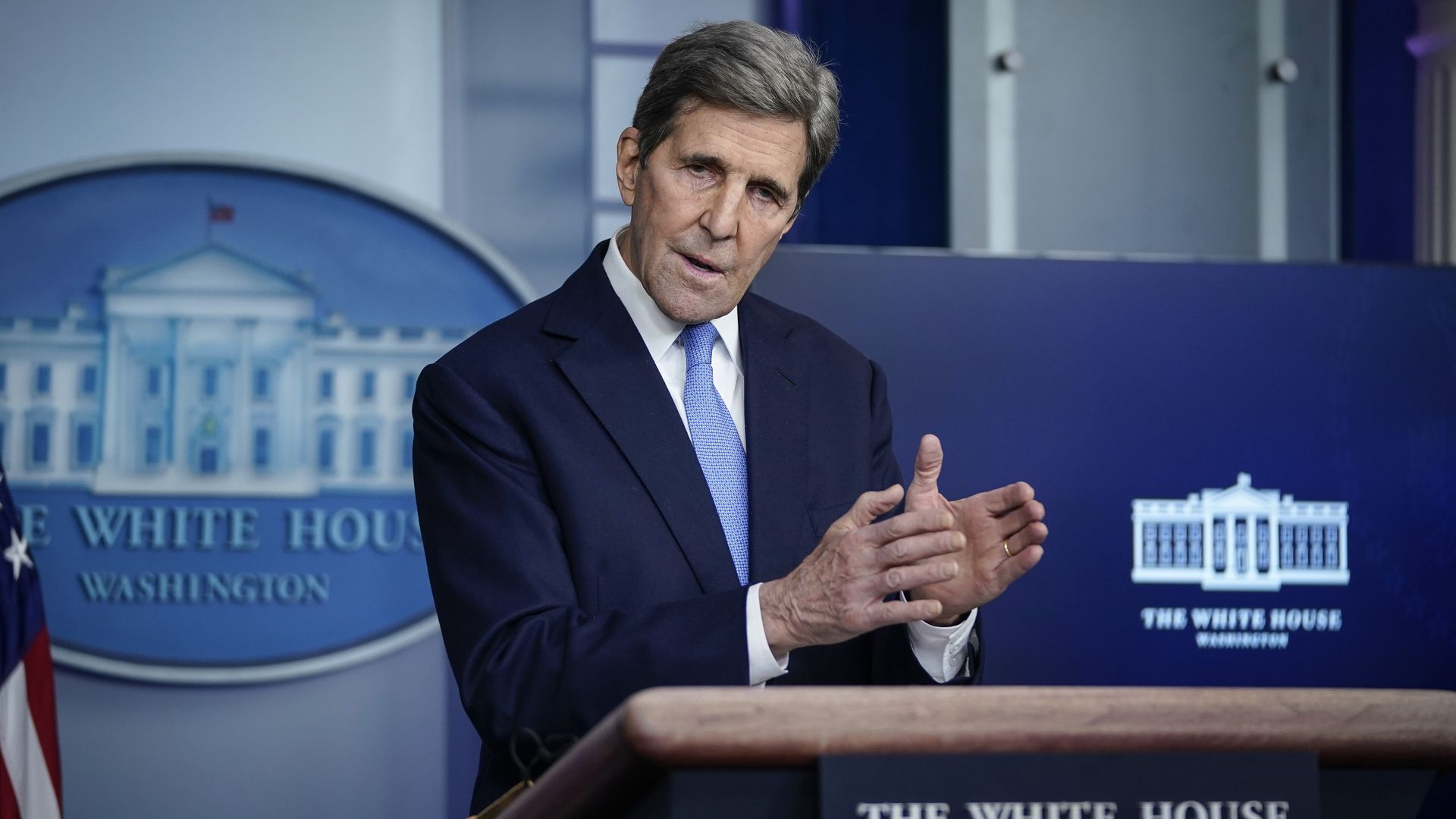 A photo of John Kerry at a podium.