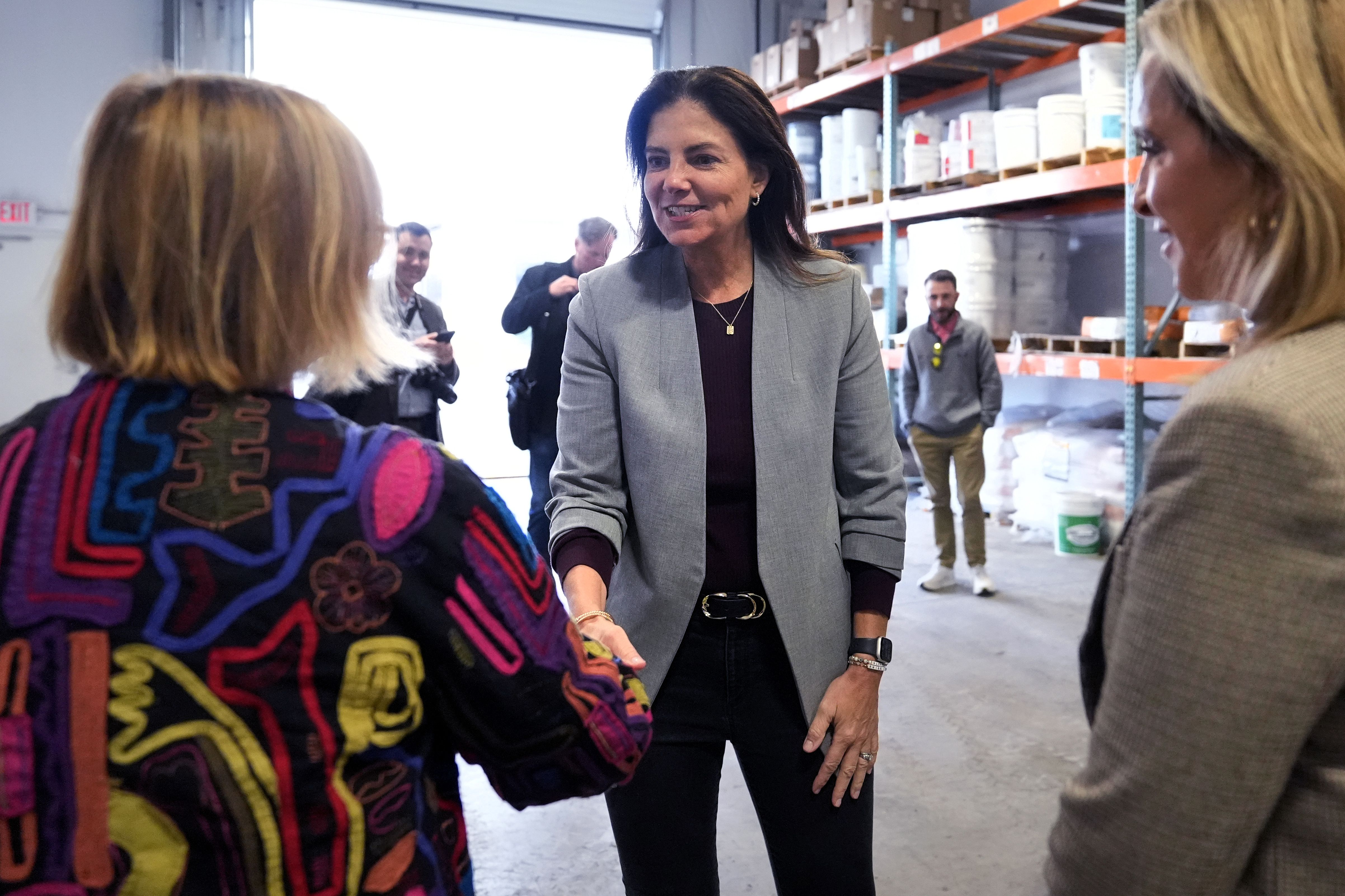 Ayotte shakes a woman's hand