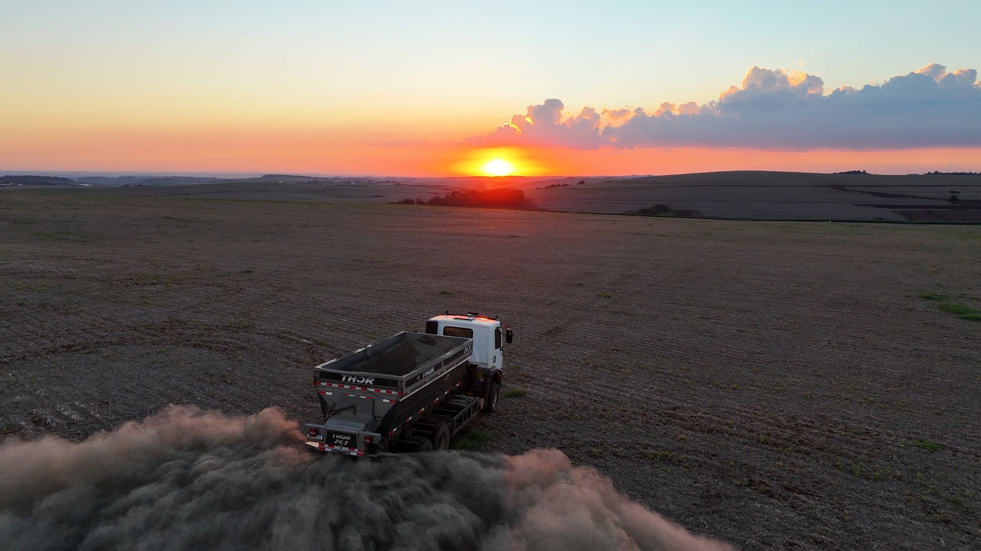 A vehicle operated by startup Terradot spreading crushed rock across farm land