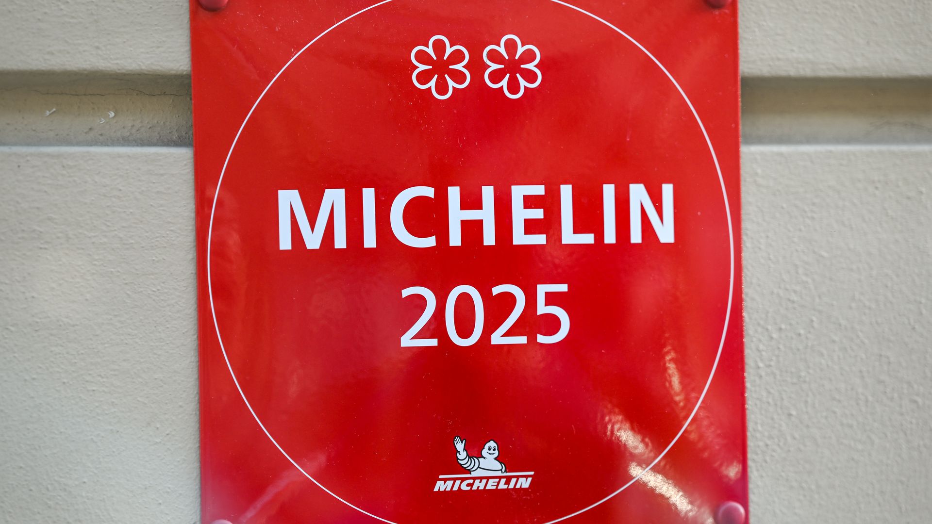 A red square sign that says "Michelin 2025."