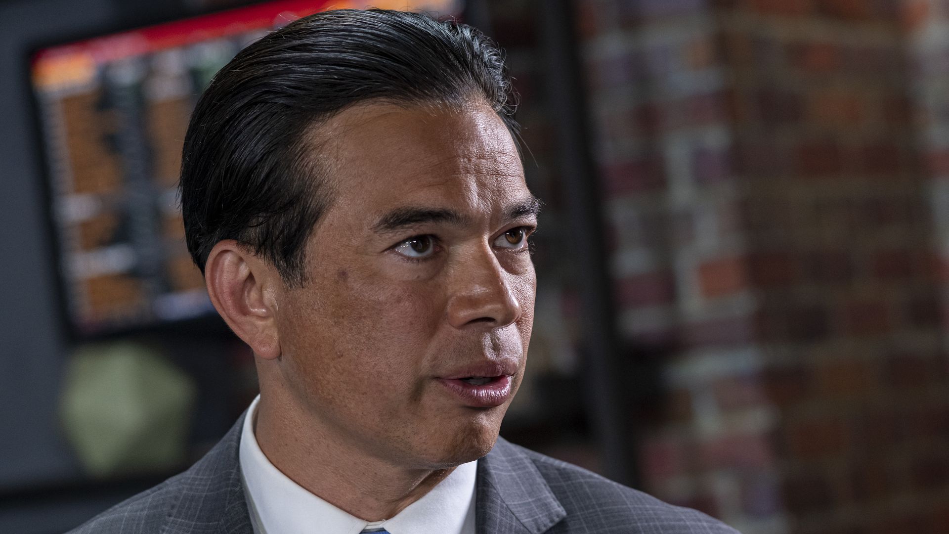 Photo of Rob Bonta from the shoulders up as he speaks