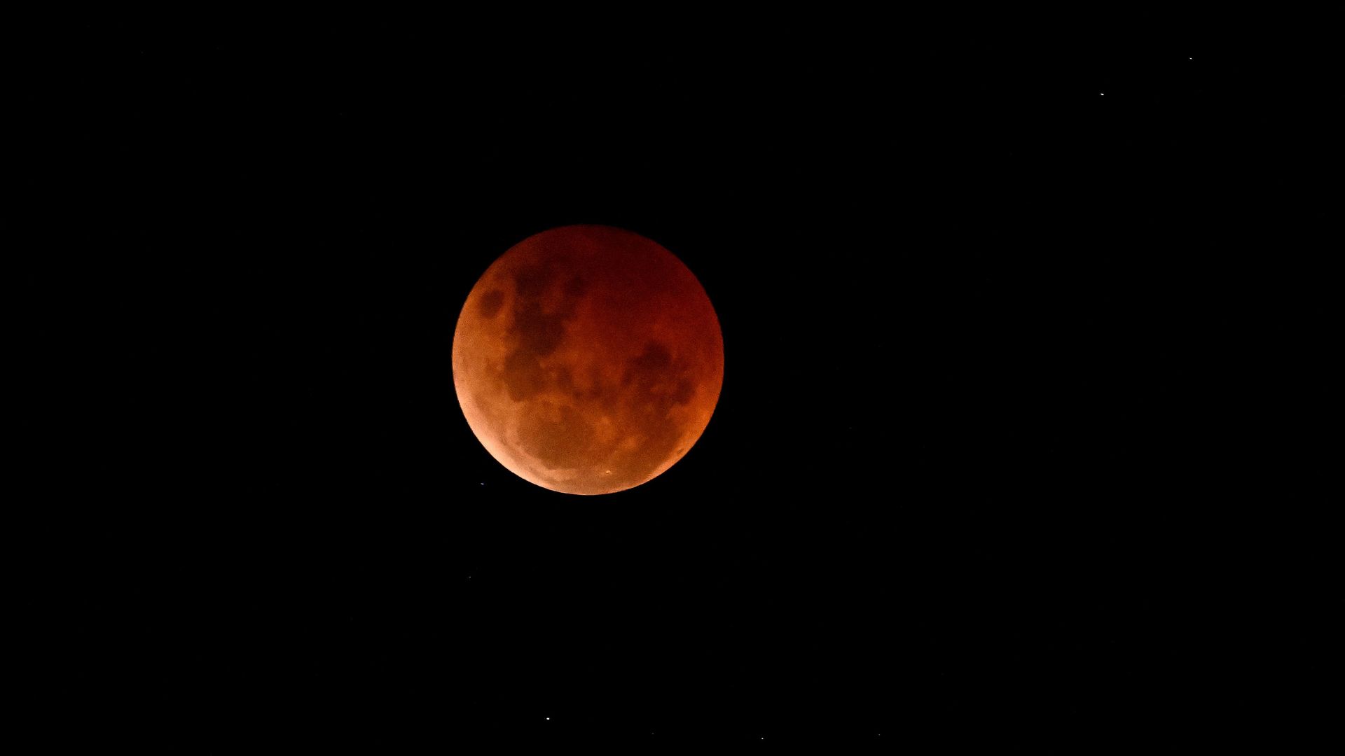 A blood moon is seen during a lunar eclipse on November 08, 2022 over Brisbane, Australia. 