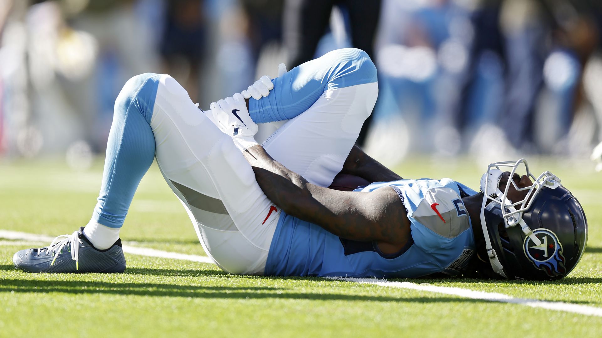 Calvin Ridley holds his leg after getting injured on Sunday.