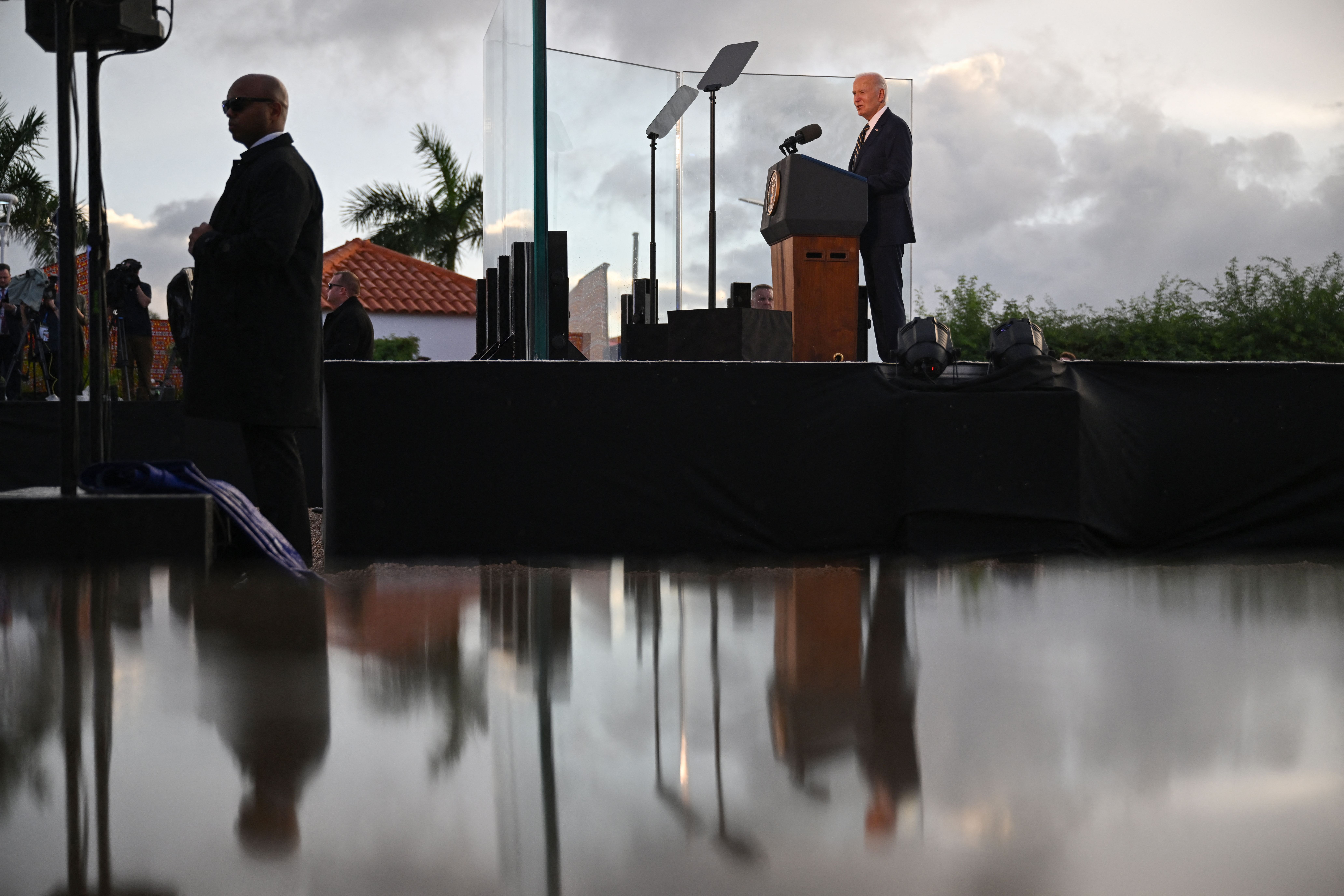 Biden speaks from behind a podium