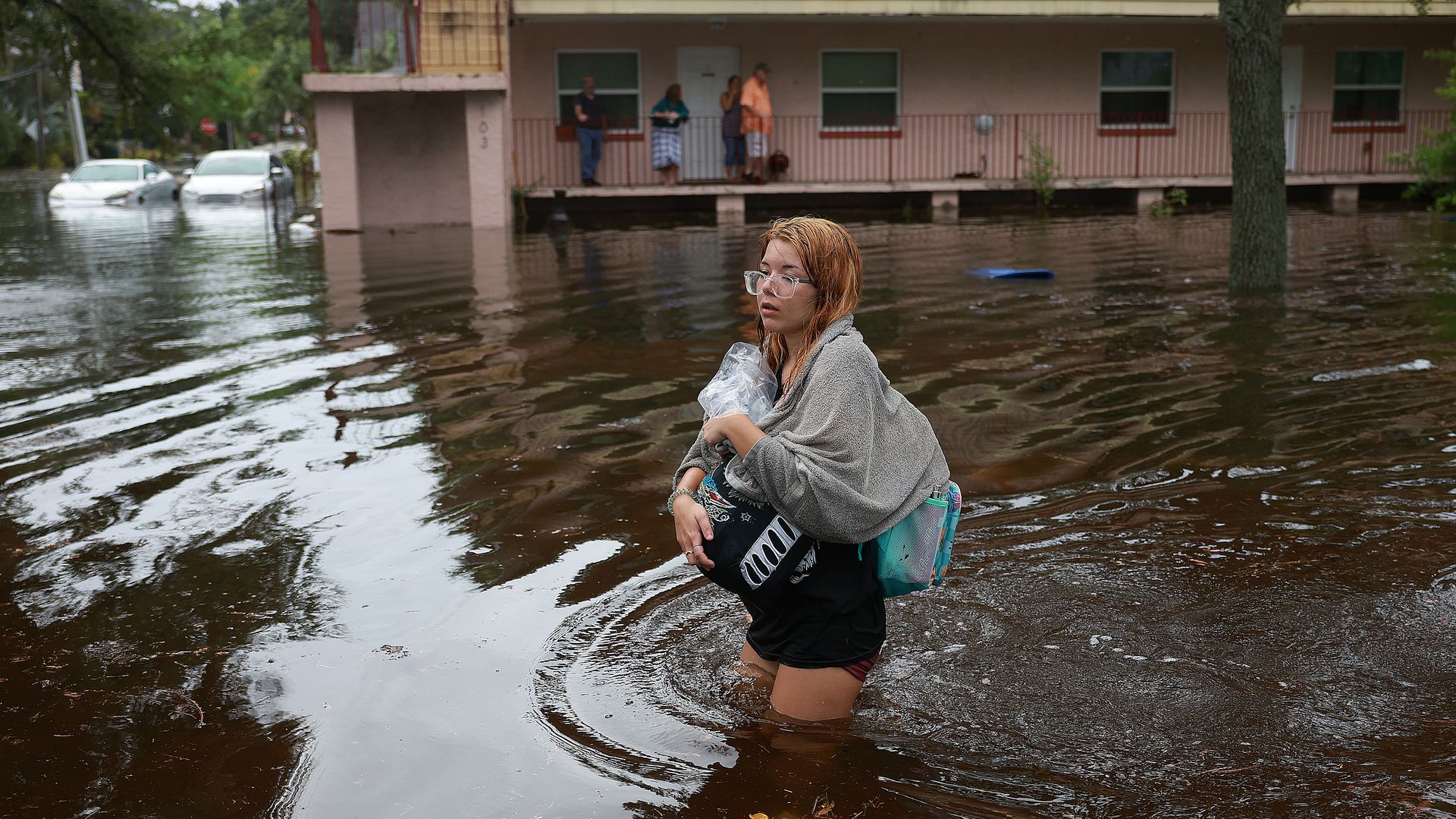 Florida woman evacuating in floodwaters