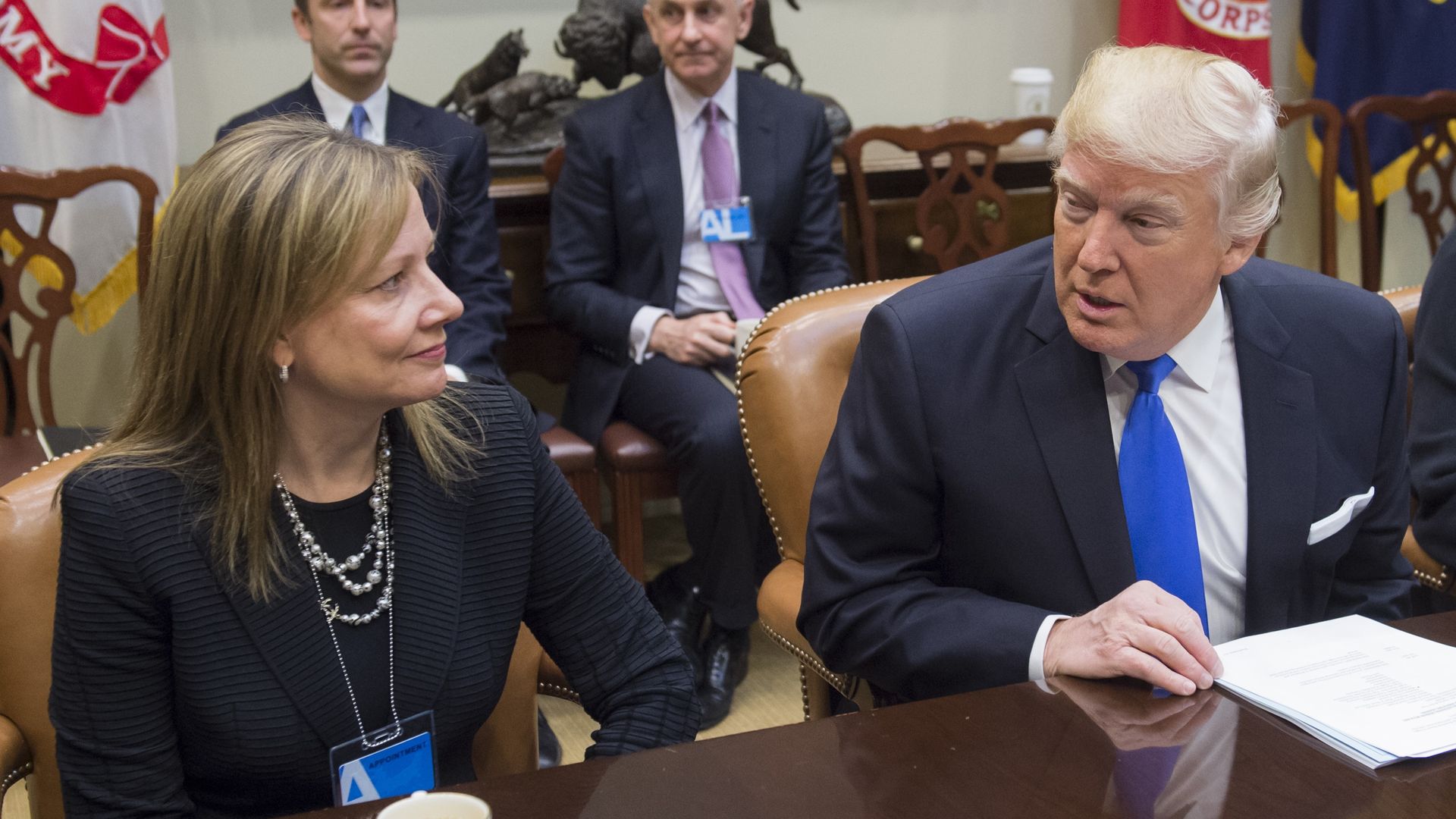 US President Donald Trump speaks with General Motors CEO Mary Barra during a meeting with automobile industry leaders in the Roosevelt Room of the White House in Washington, DC, January 24, 2017.