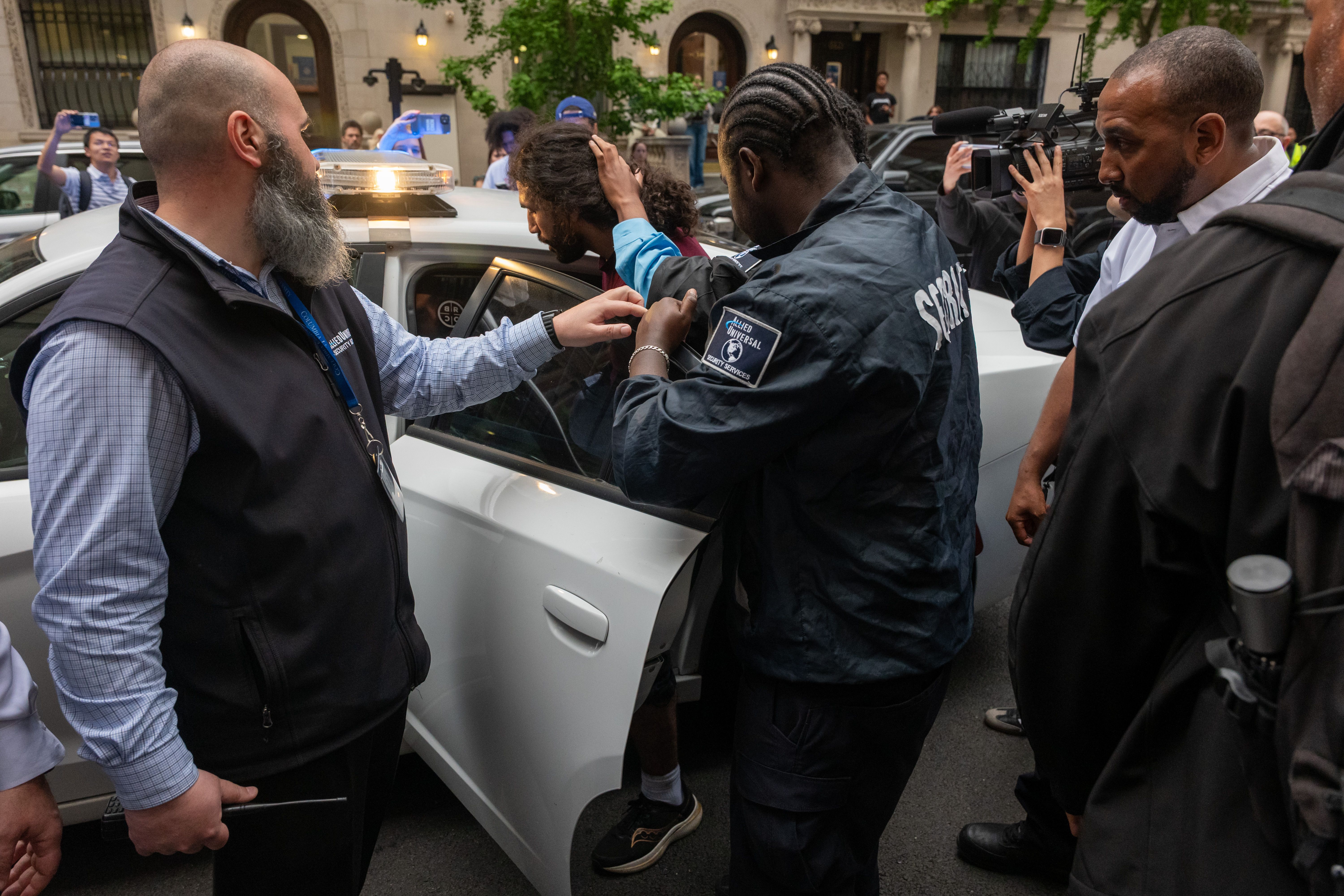 NEW YORK, NEW YORK - MAY 07: A person is detained outside of Columbia University's Butler Library after pro-Palestinian protesters occupied the space on May 07, 2025 in New York City. Crowds of protesters grew as a standoff with security and a group calling themselves "Columbia University Apartheid